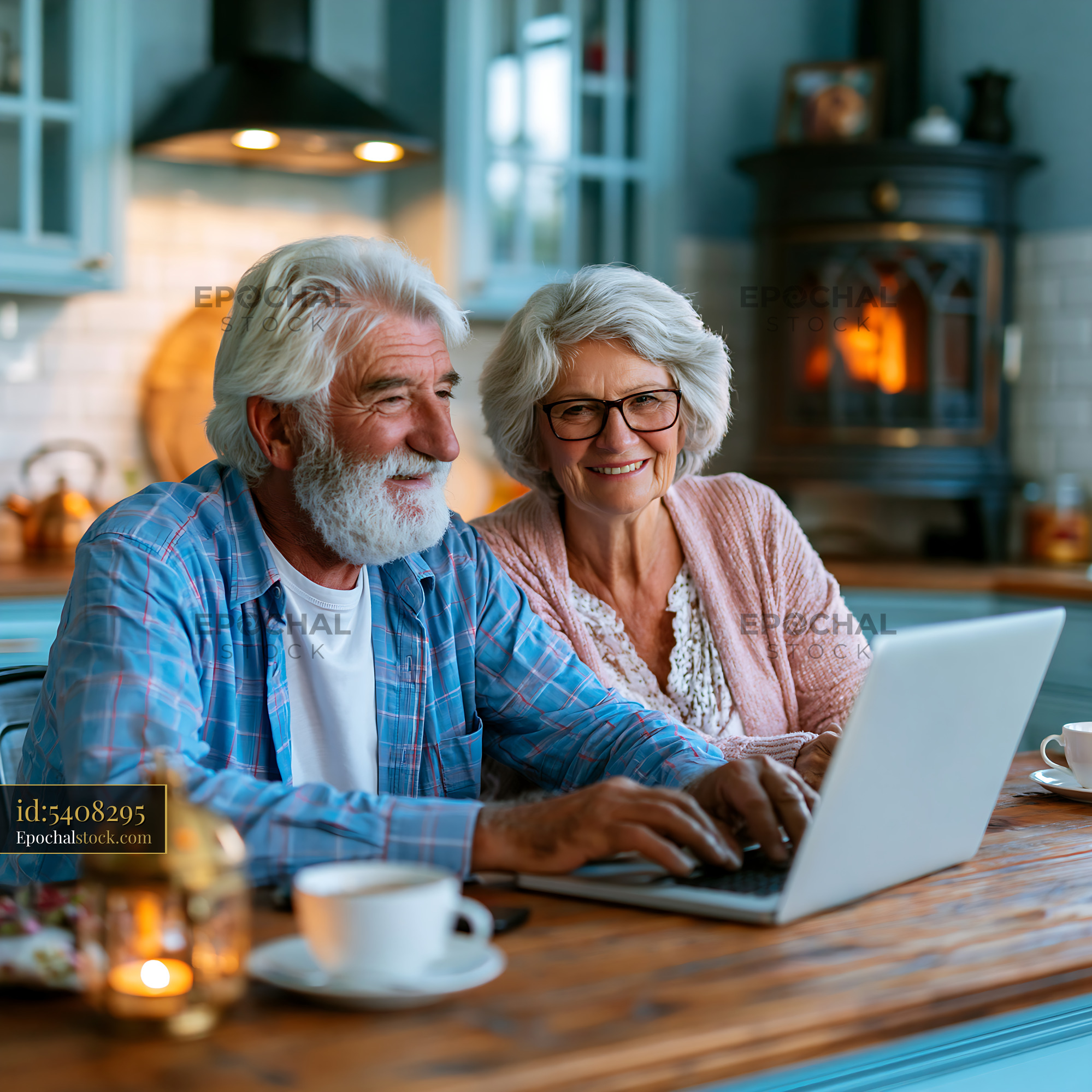 Retired Couple Using Laptop at Home During Winter Evening - stock photo