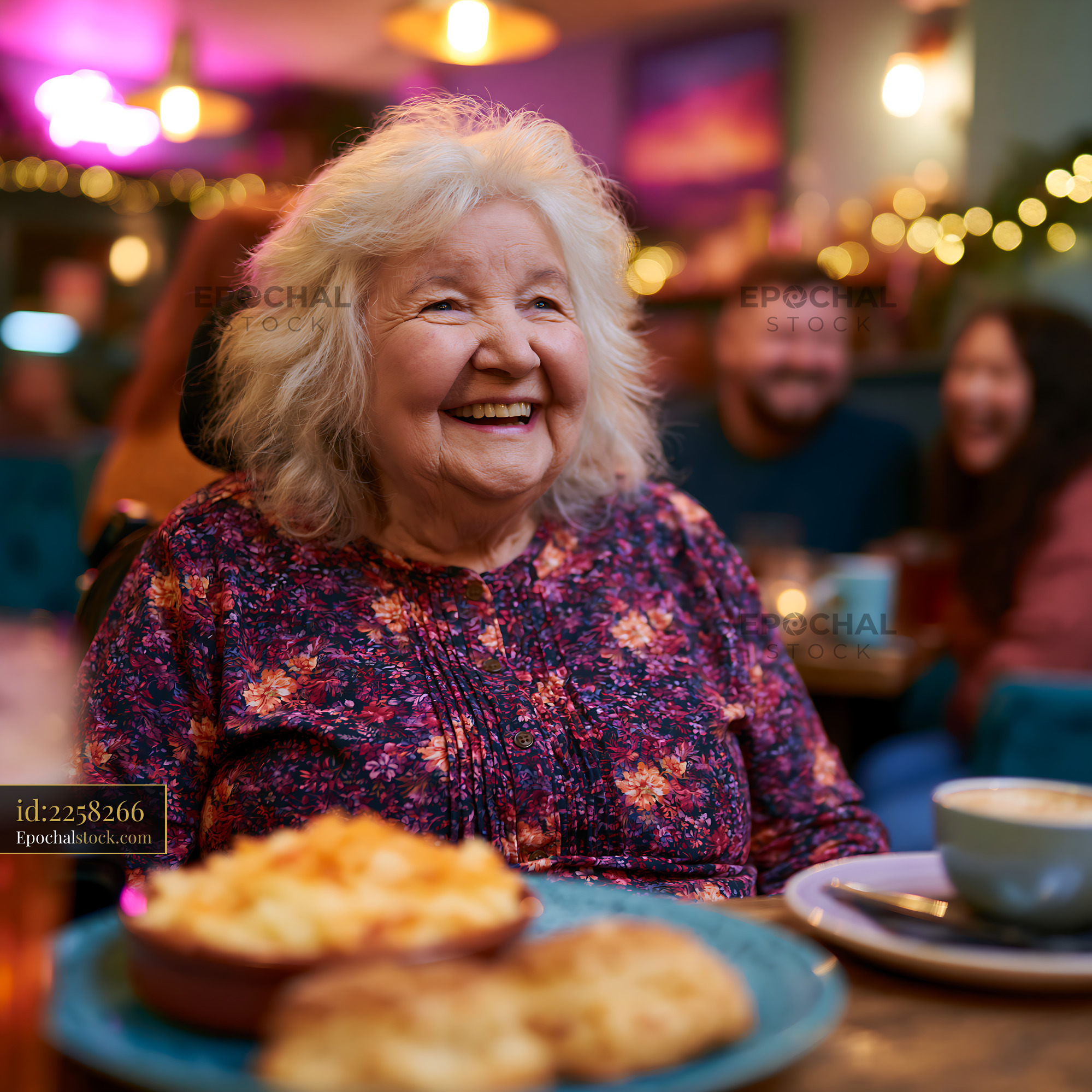 Laughing Grandmother Enjoying Food in a Cafe Setting - stock photo