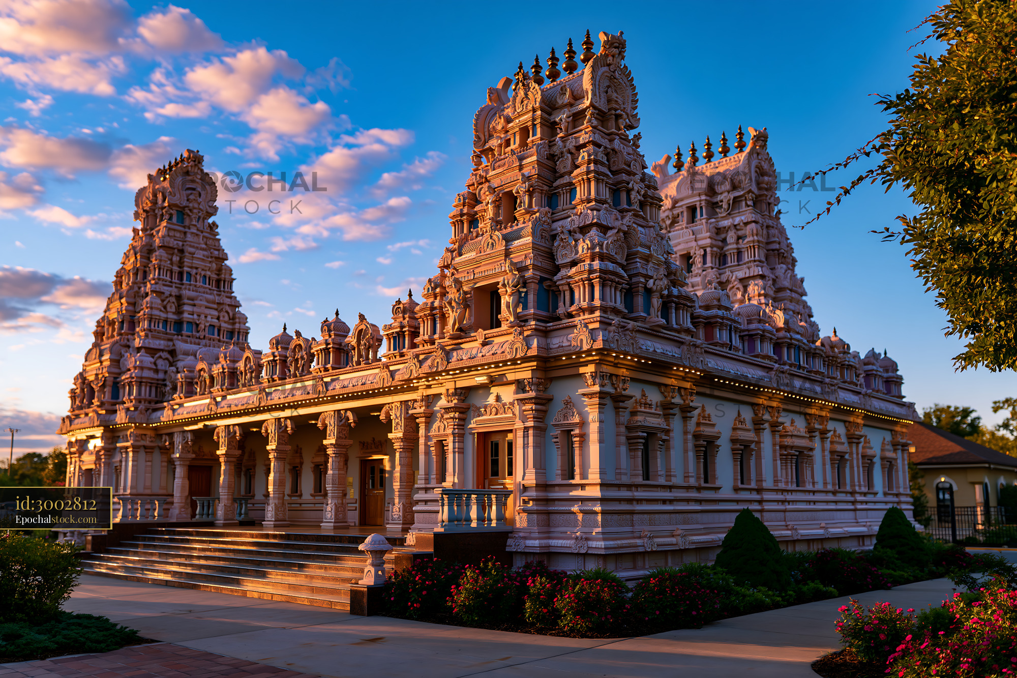 Watermarked full-resolution preview of Sunset view of a temple with intricate architecture and blue sky