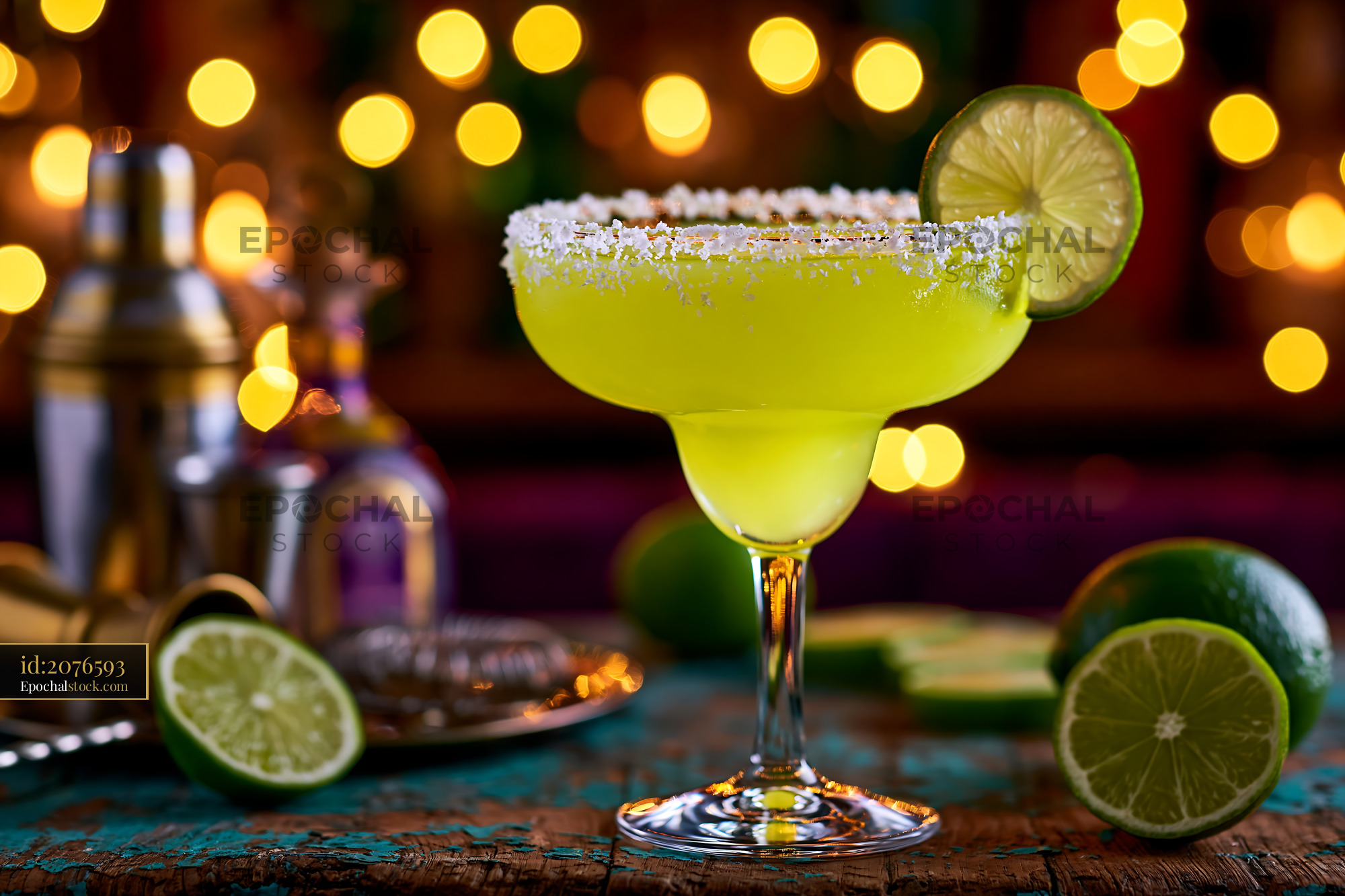 Watermarked full-resolution preview of Colorful margarita glass with lime and salt on bar counter