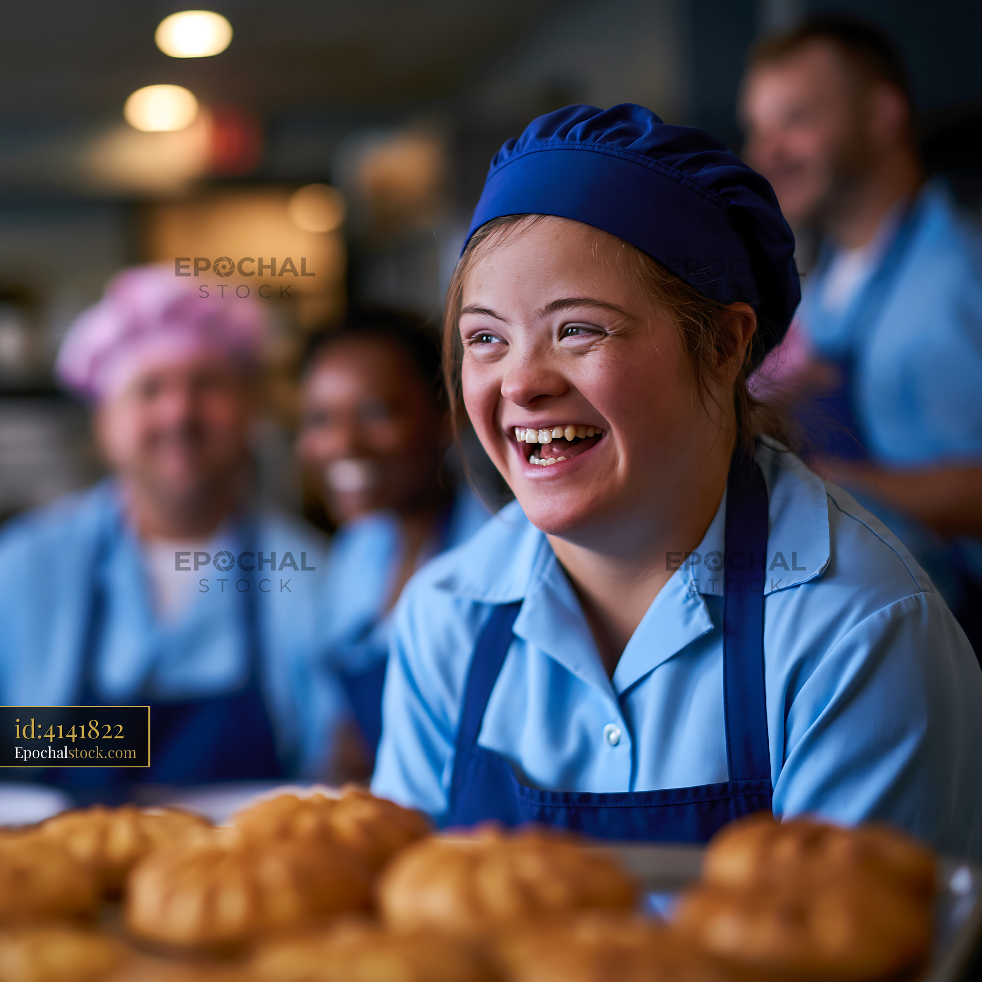 Watermarked full-resolution preview of Bakery workers smile while preparing pastries in a busy kitchen