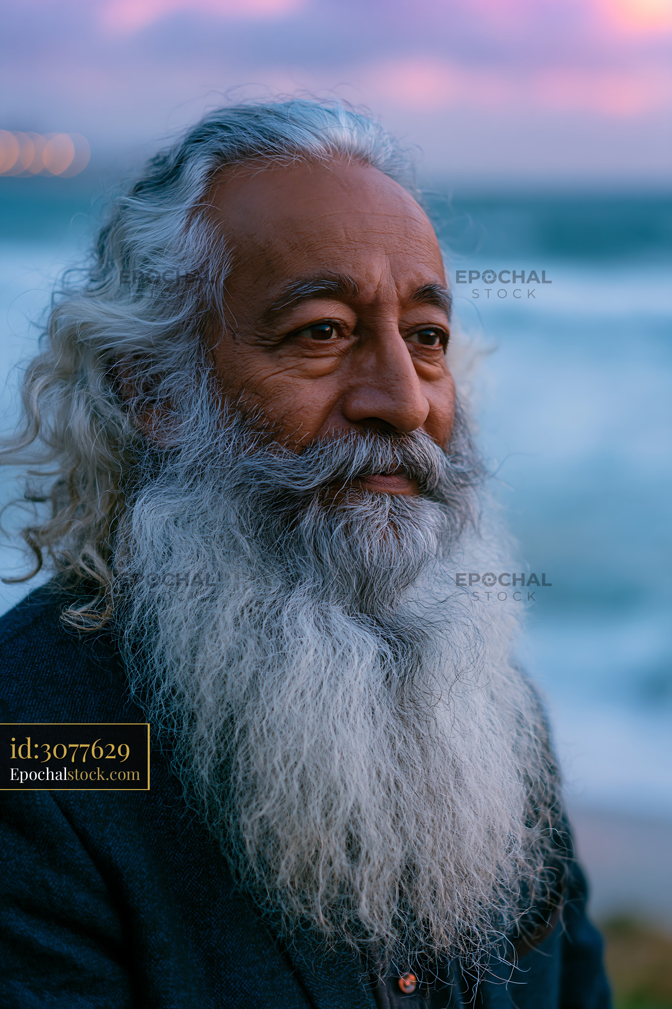 Watermarked full-resolution preview of Man with long beard near the ocean at sunset