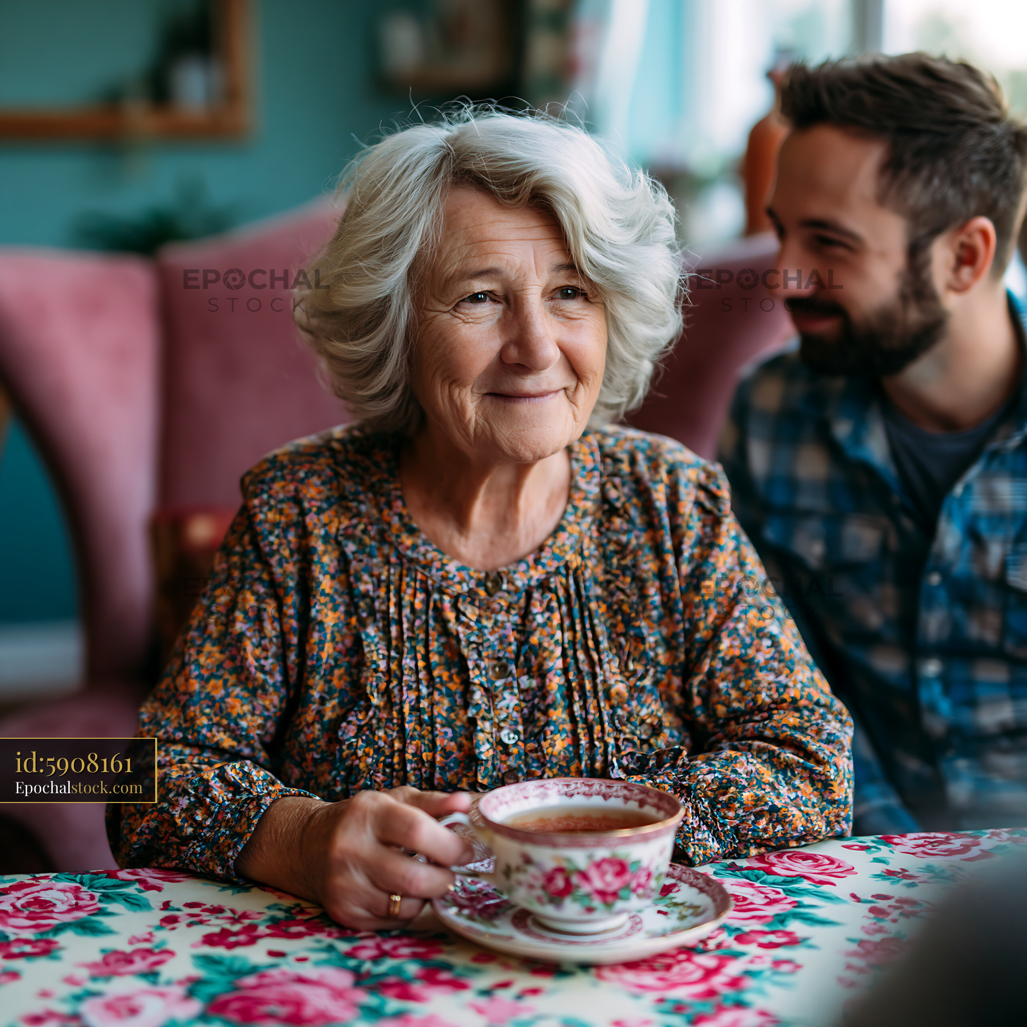 Watermarked full-resolution preview of Elderly woman enjoys tea while talking with a younger man
