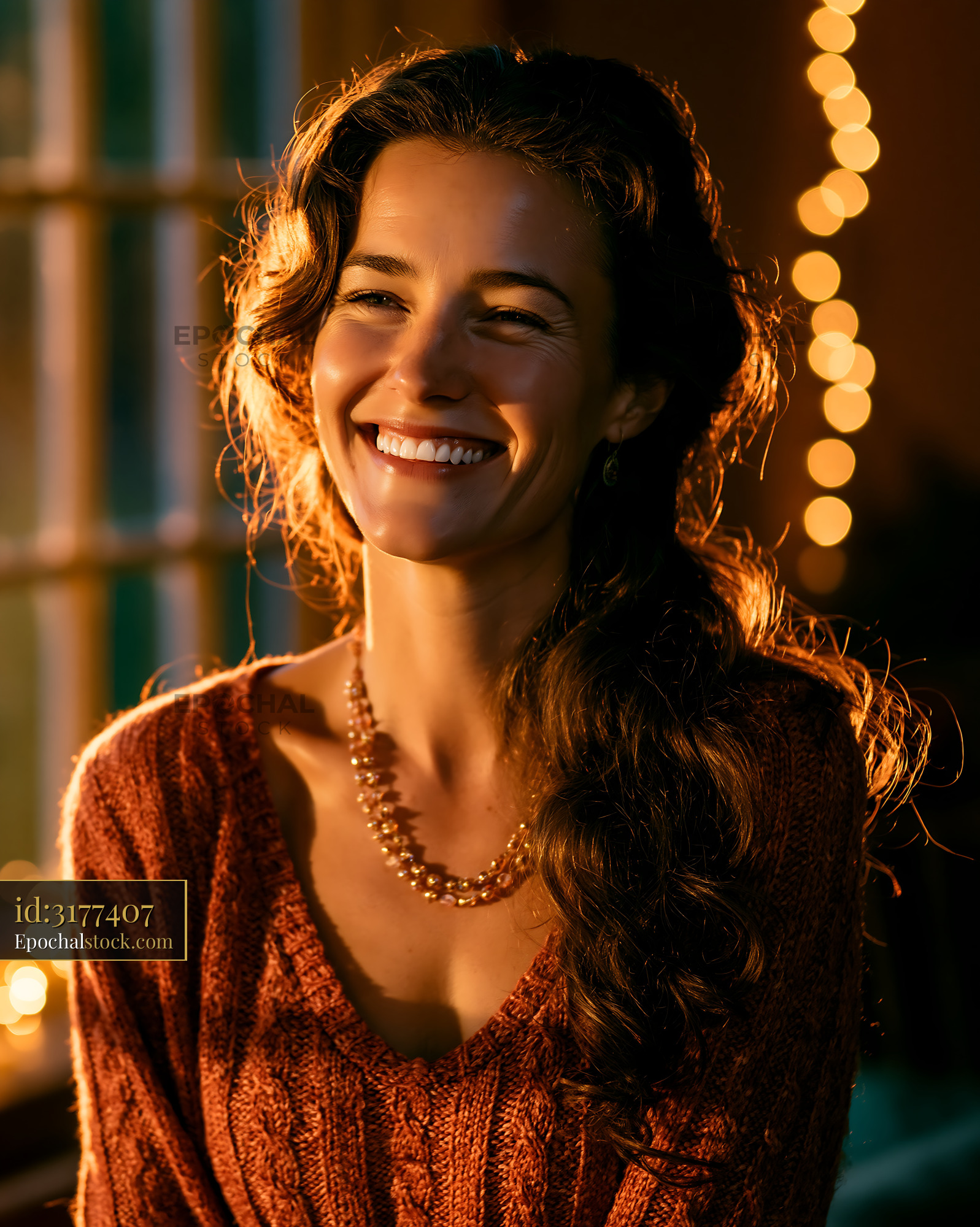 Watermarked full-resolution preview of Woman smiling in warm light with festive background
