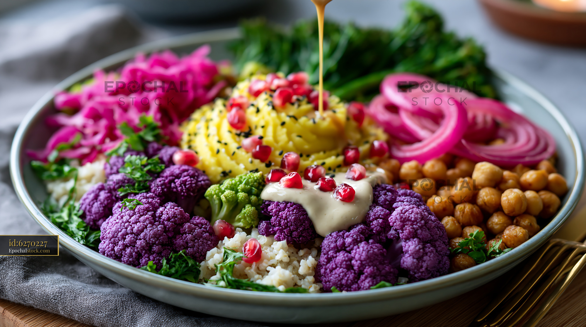 Watermarked full-resolution preview of Colorful bowl of fresh vegetables and grains with dressing