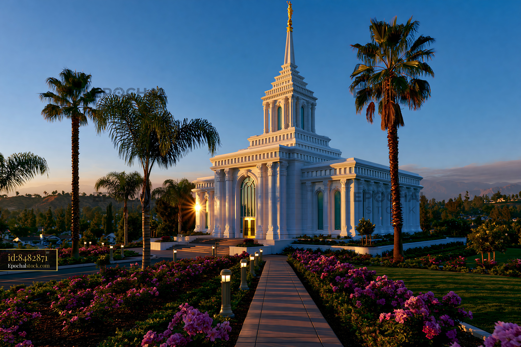 Watermarked full-resolution preview of Sunset view of a temple surrounded by palm trees and flowers