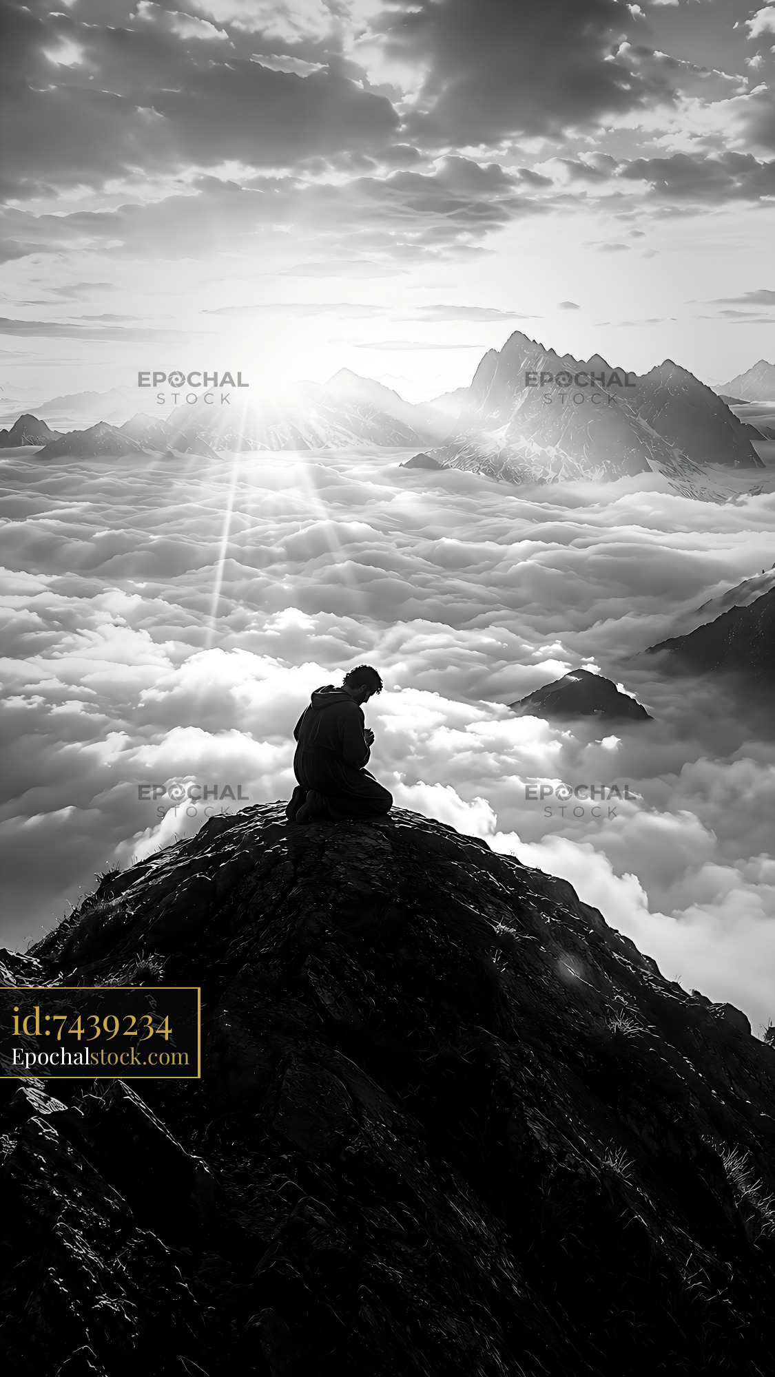 Watermarked full-resolution preview of Man sitting on a mountain peak above the clouds at sunrise