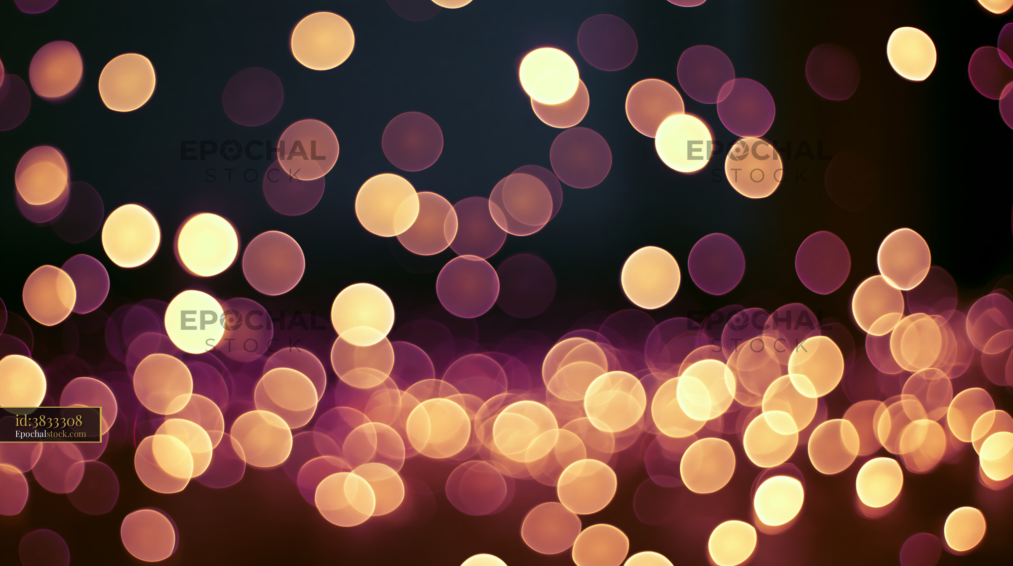 Watermarked full-resolution preview of Warm bokeh lights create a dreamy background at night
