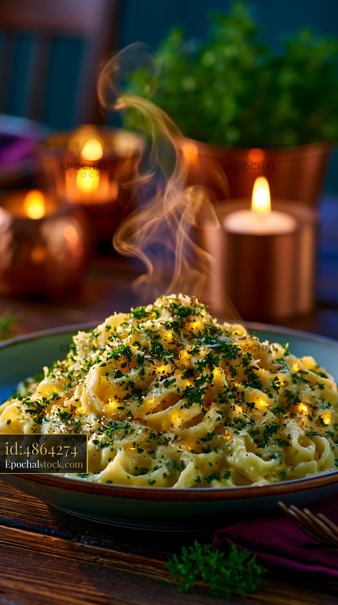 Watermarked full-resolution preview of Steaming plate of pasta with herbs and candles in the background