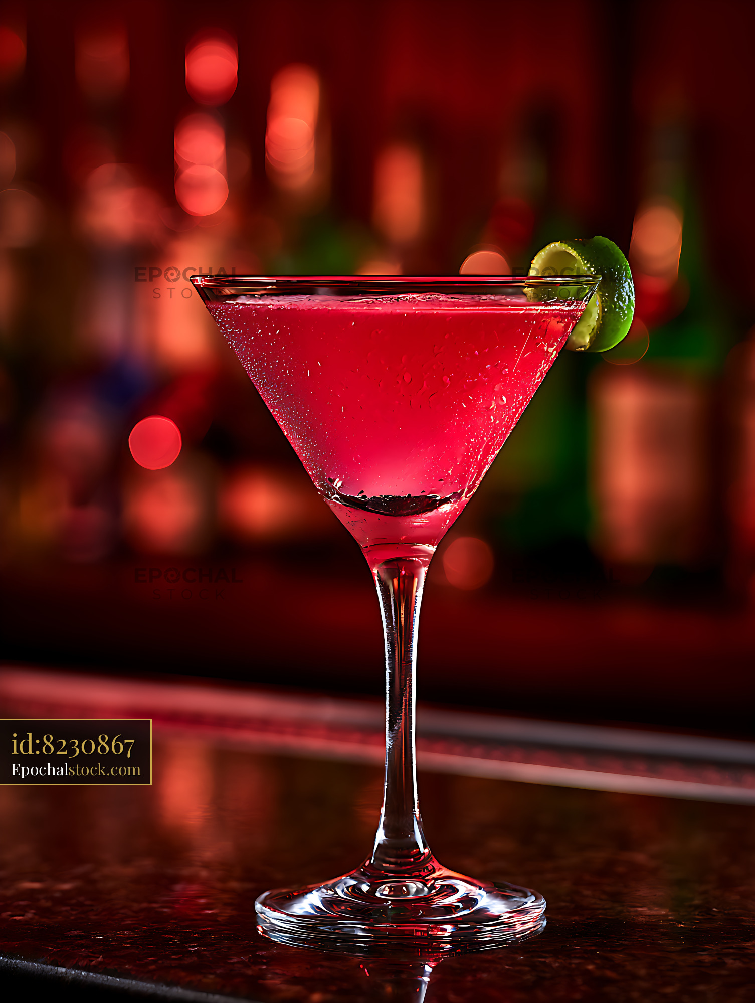 Watermarked full-resolution preview of Vibrant red cocktail with lime on a reflective bar