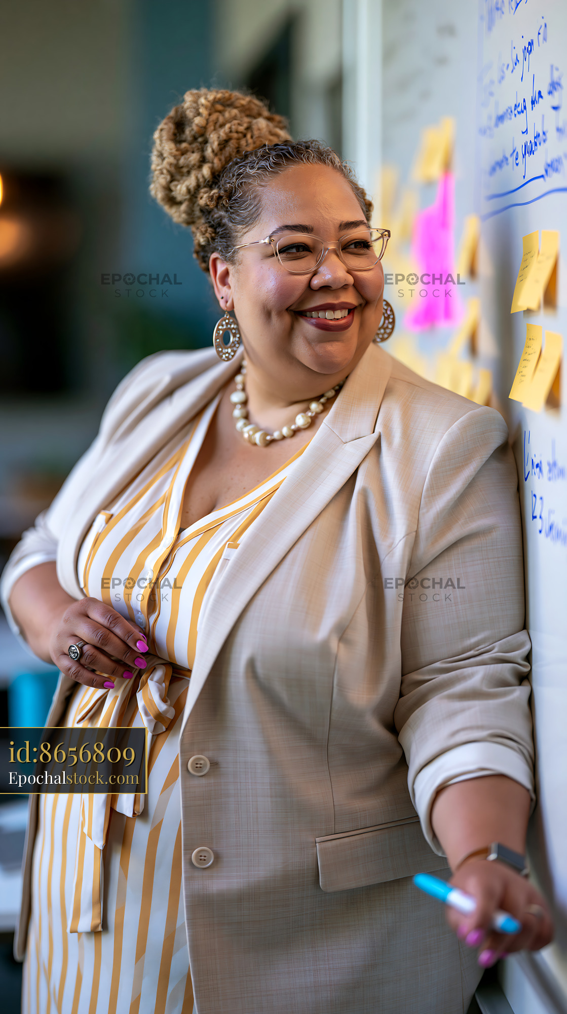 Watermarked full-resolution preview of Business professional smiling during a meeting with sticky notes
