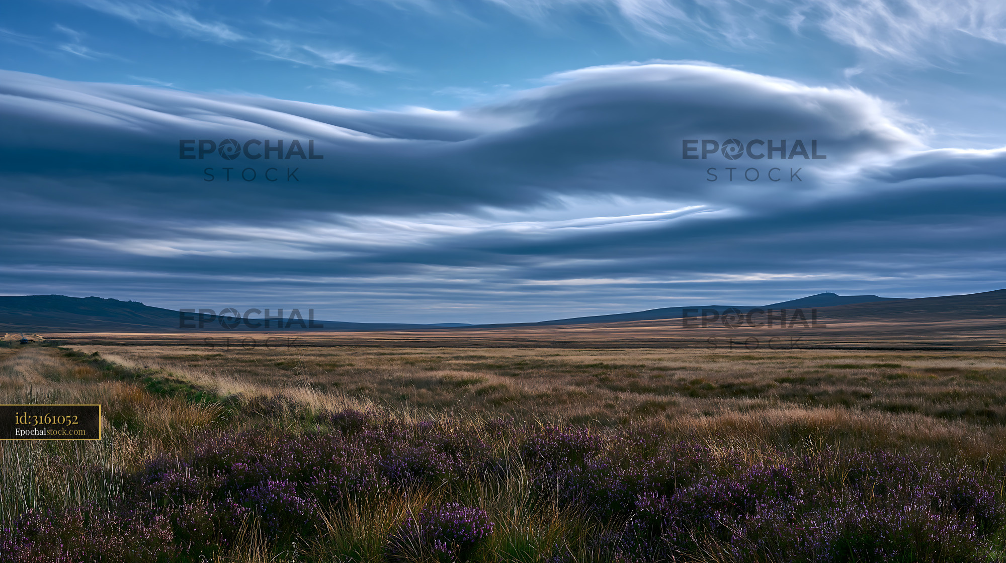 Watermarked full-resolution preview of Wide open landscape with clouds above hills and fields