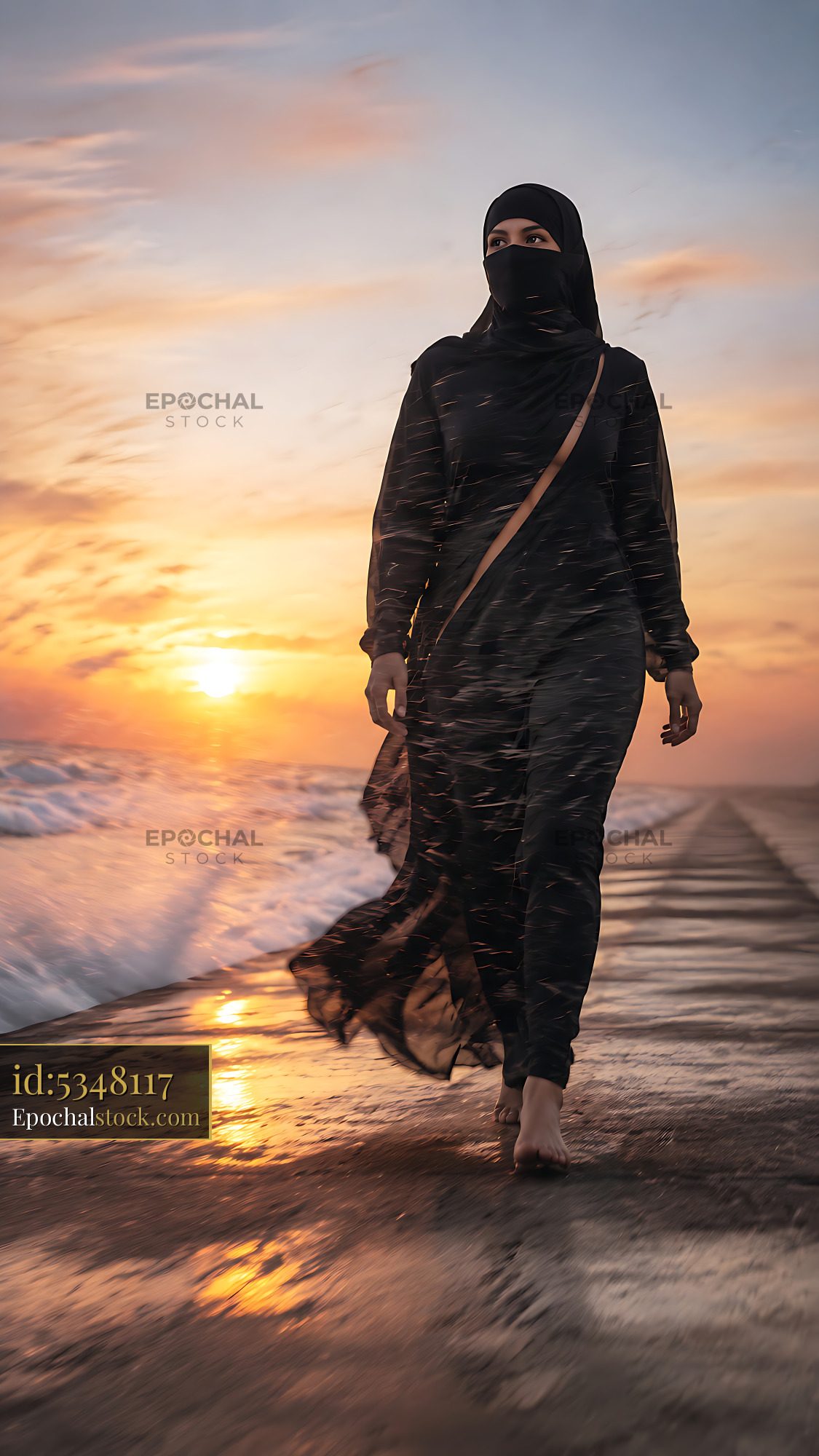 Watermarked full-resolution preview of Woman walking on beach during sunset