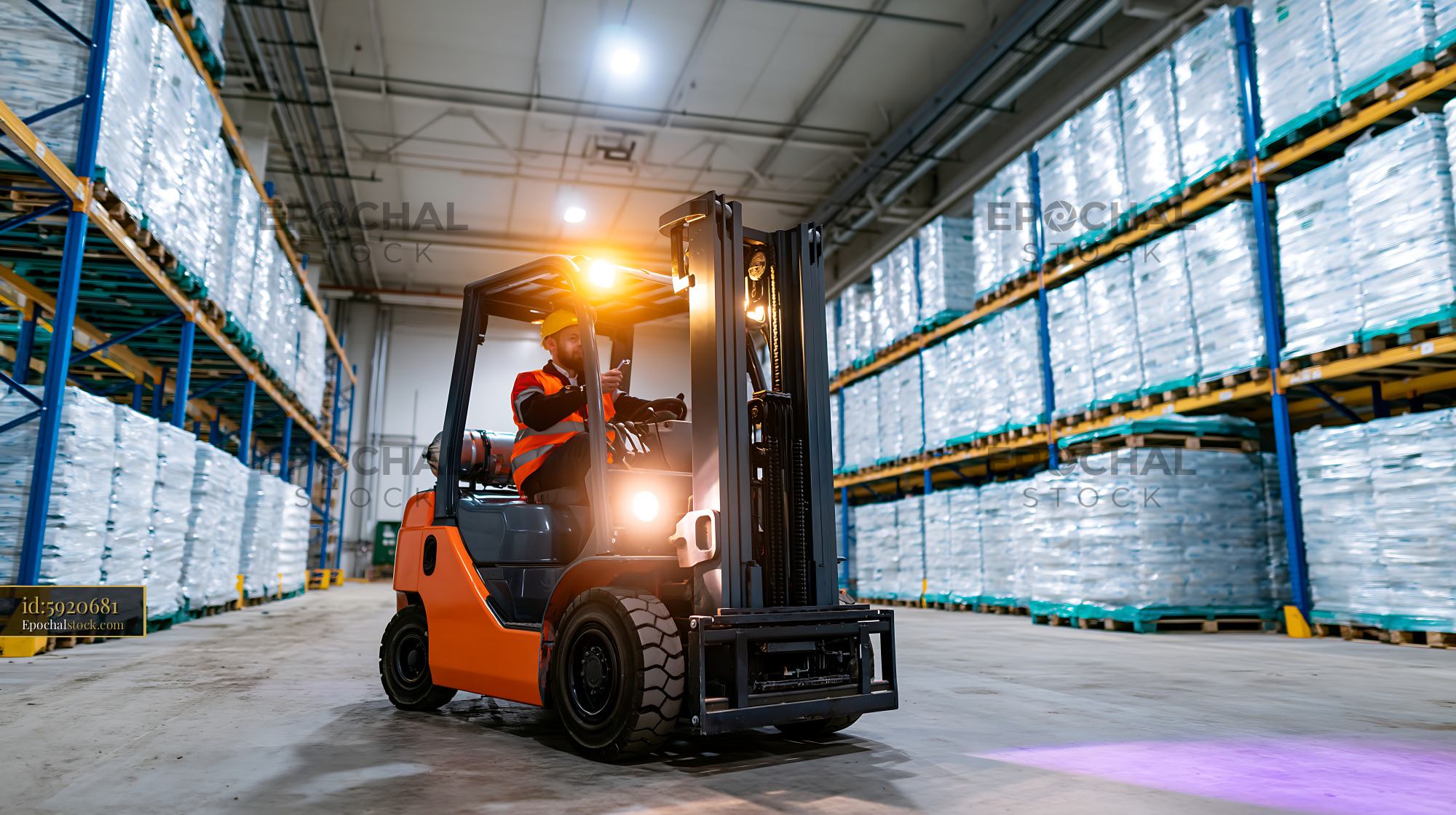 Watermarked full-resolution preview of Forklift operator moving pallets in a warehouse setting