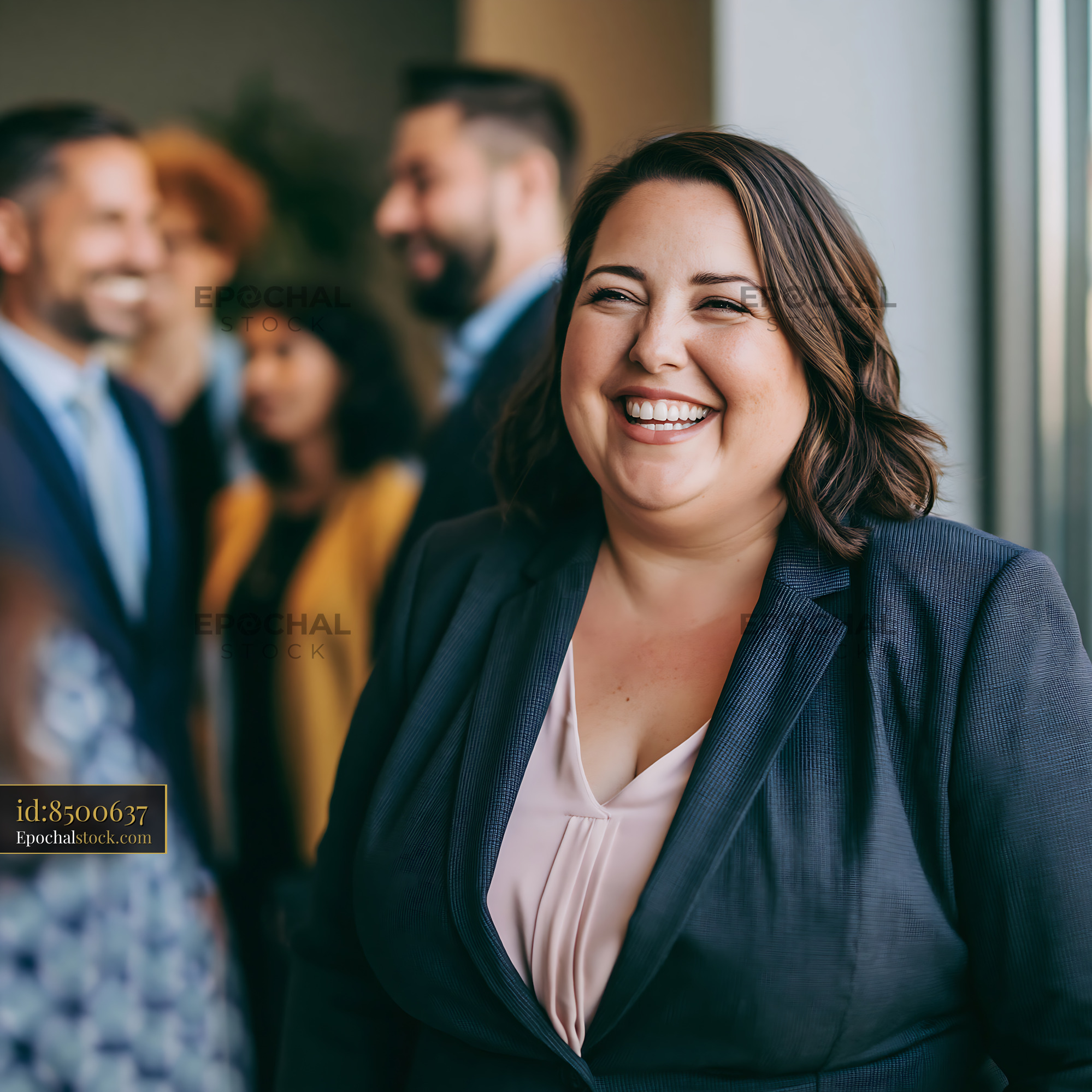 Watermarked full-resolution preview of Group of professionals at an office gathering with a smiling woman
