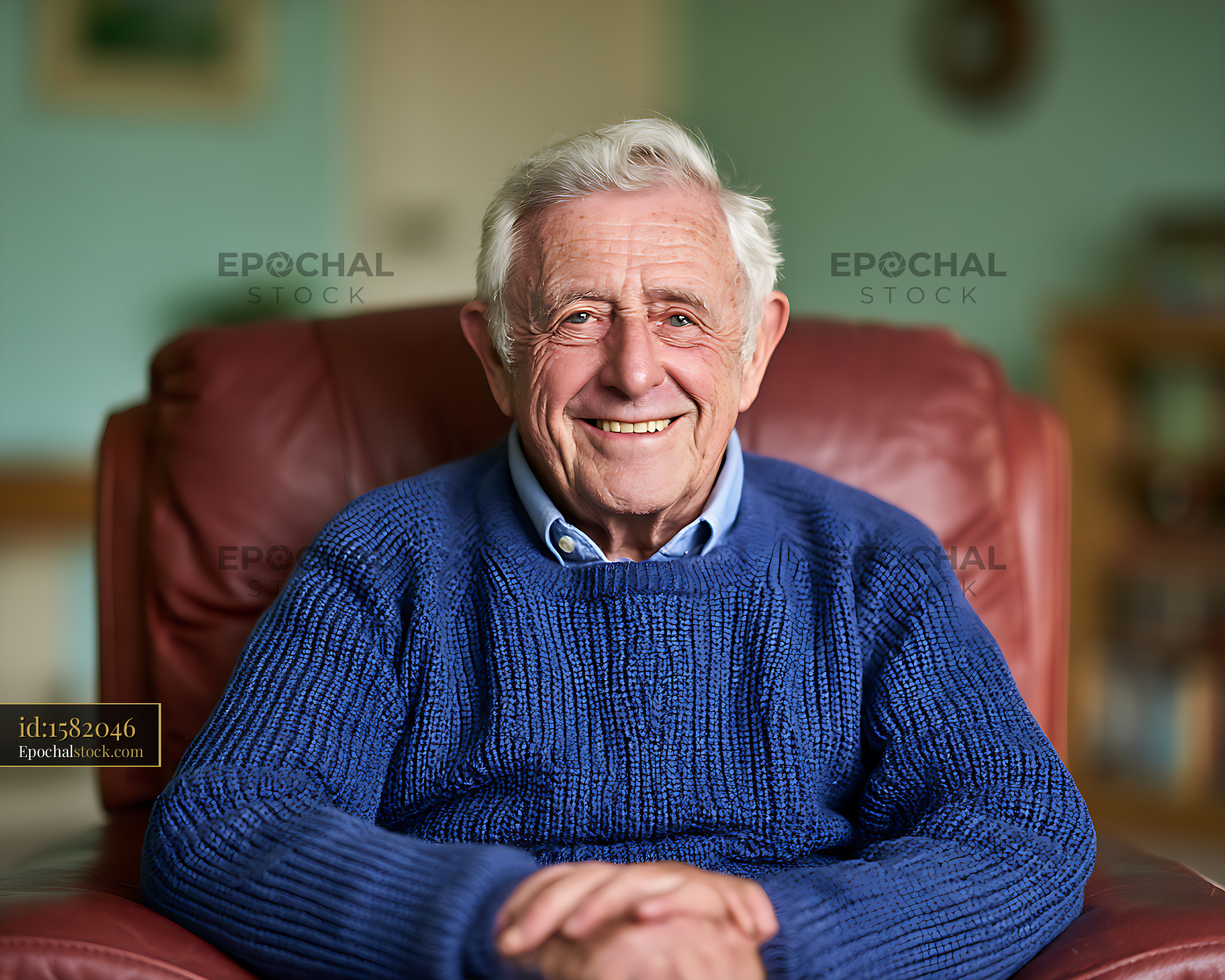 Watermarked full-resolution preview of Friendly portrait of an elderly man in a blue sweater