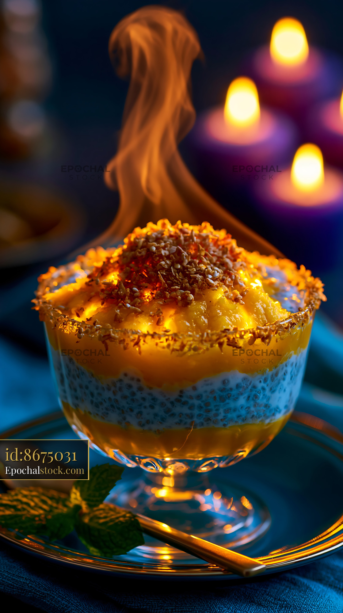 Watermarked full-resolution preview of Sweet dessert topped with flames served in a glass bowl