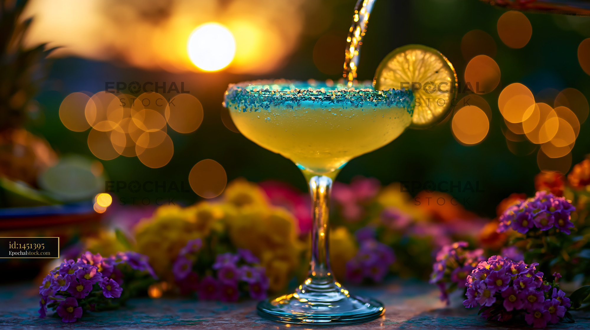 Watermarked full-resolution preview of Sunset cocktail with lime and flowers on a table