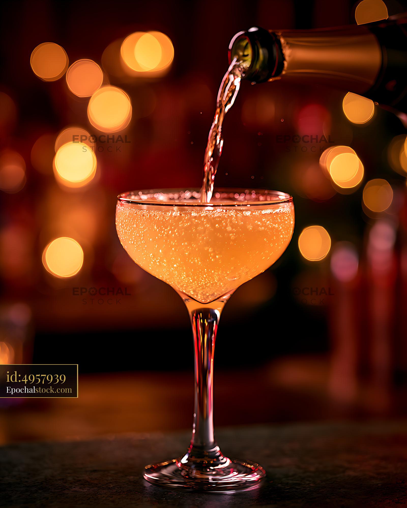 Watermarked full-resolution preview of Orange cocktail poured into an elegant coupe glass