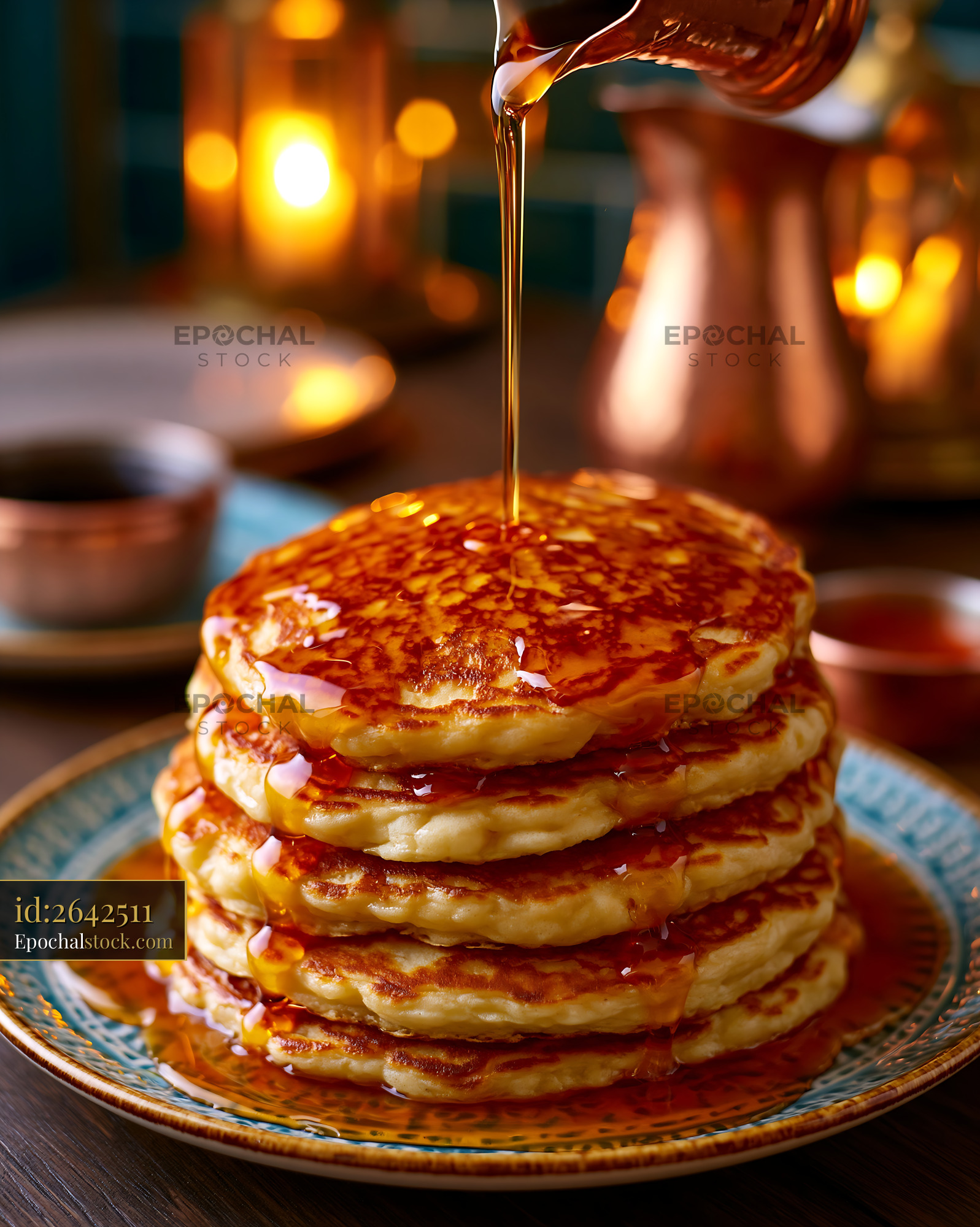 Watermarked full-resolution preview of Pancakes stacked high with syrup drizzle and warm lighting