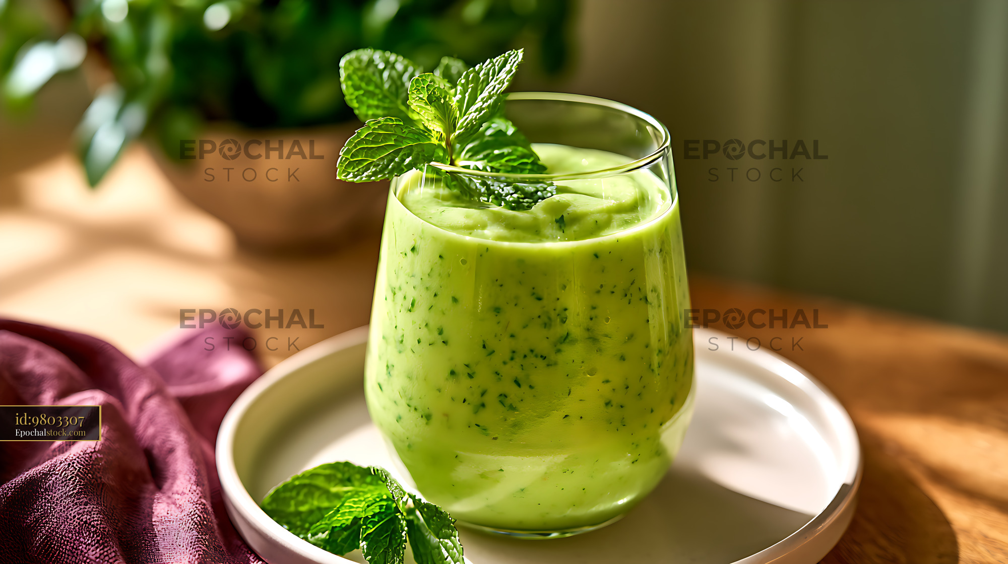 Watermarked full-resolution preview of Fresh green smoothie garnished with mint leaves