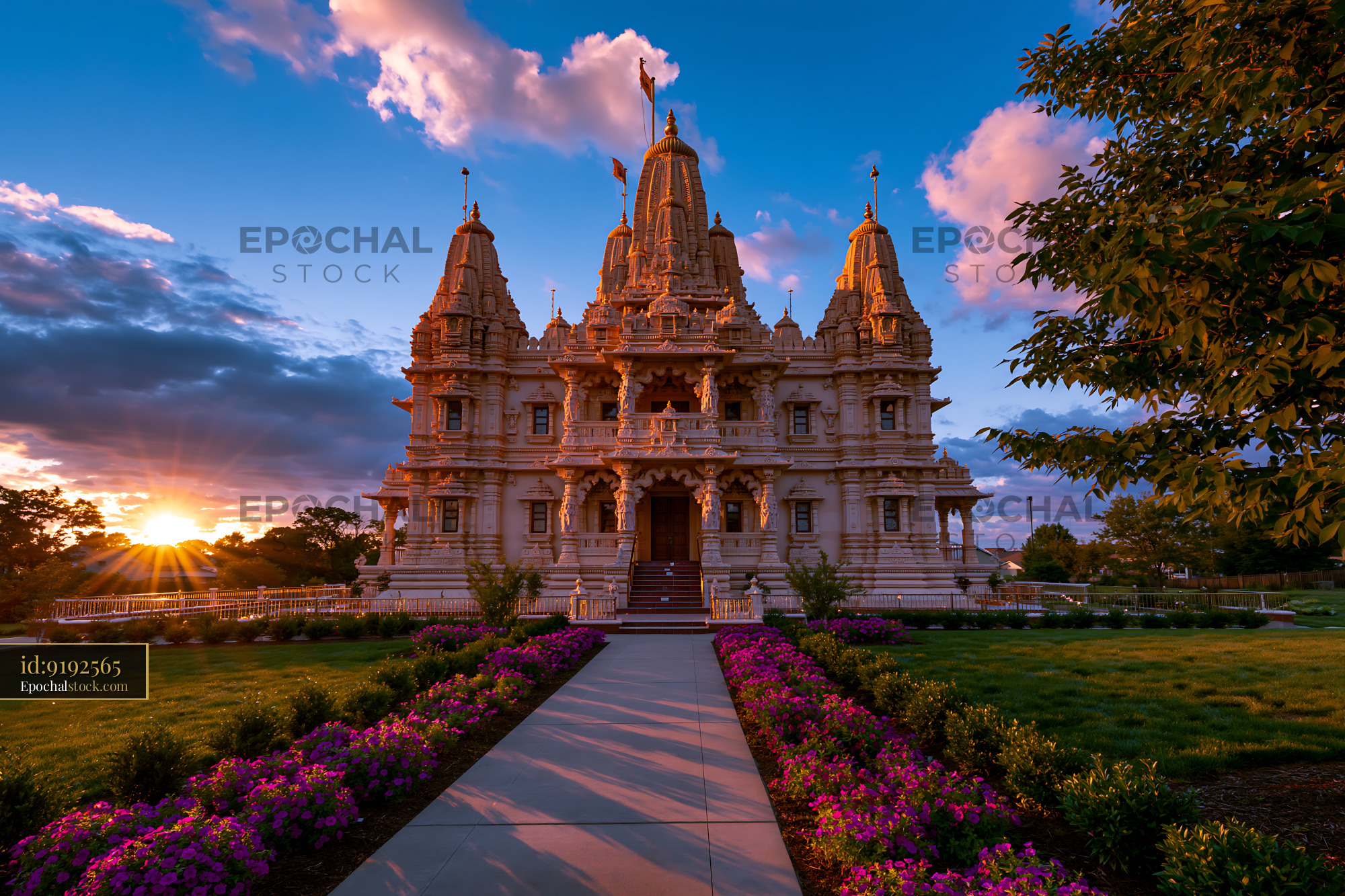 Watermarked full-resolution preview of Sunset view of the ornate temple surrounded by colorful flowers