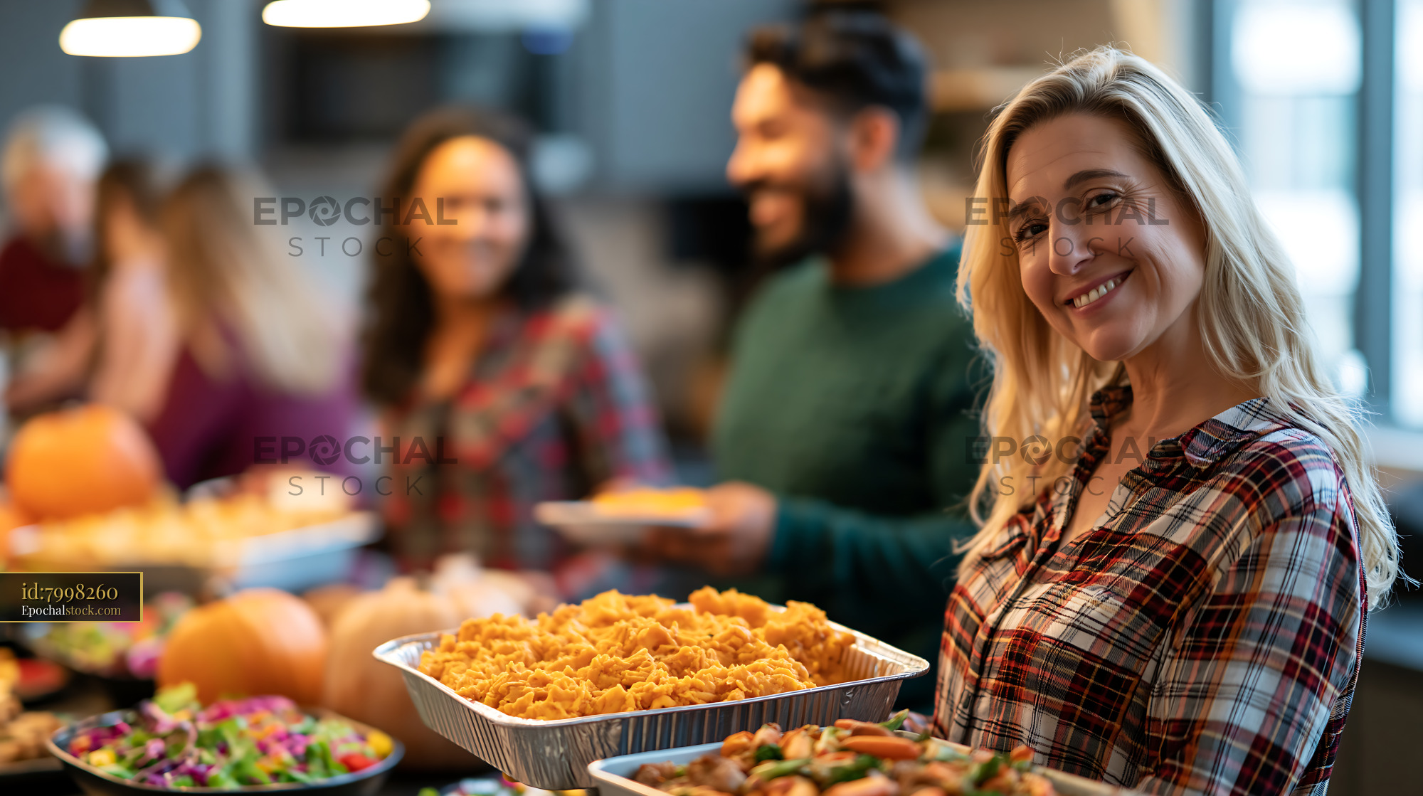 Watermarked full-resolution preview of Gathering of friends enjoying food indoors during a festive event