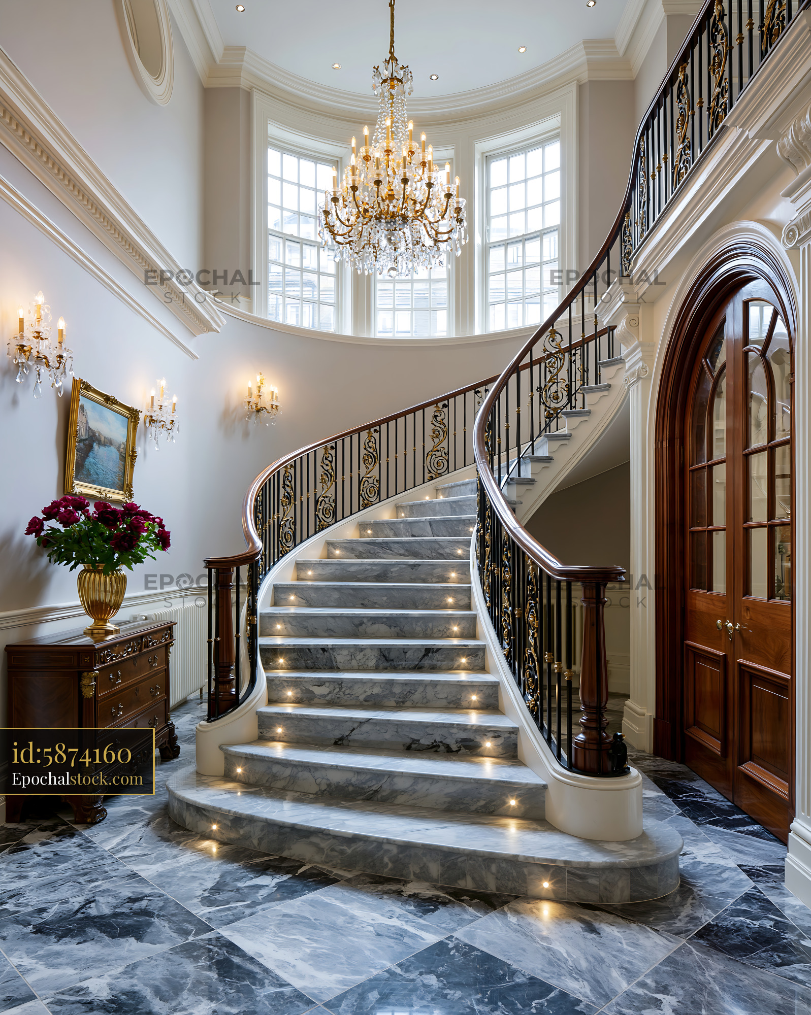 Watermarked full-resolution preview of Elegant staircase in a grand hallway with chandelier and floral decor