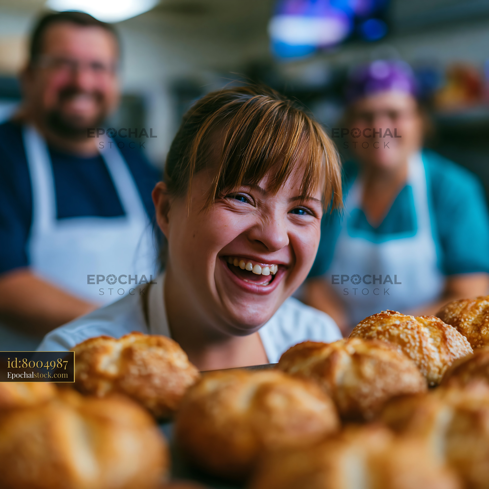 Watermarked full-resolution preview of Bakery workers smiling and preparing bread products