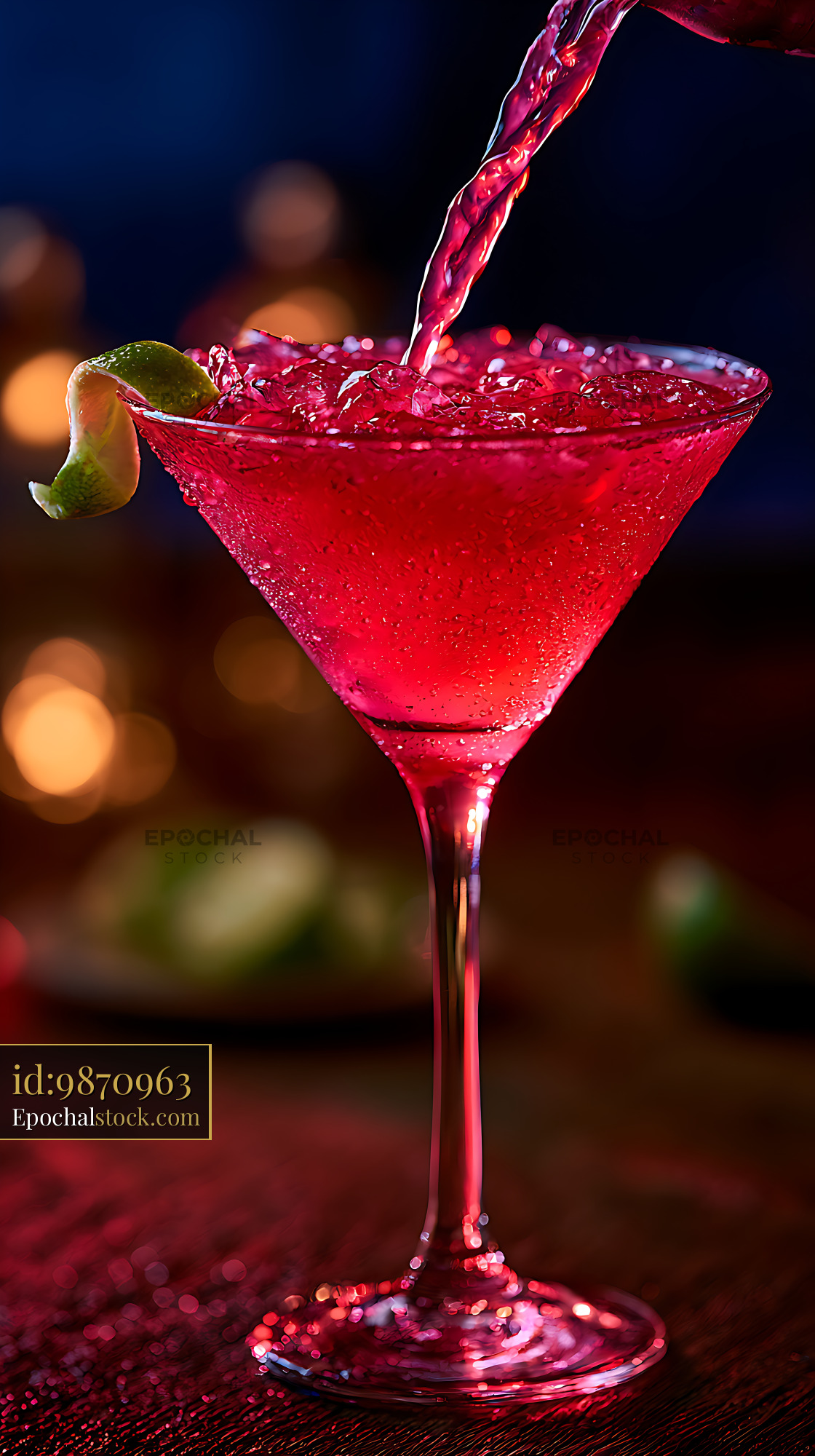 Watermarked full-resolution preview of Vibrant red cocktail being poured into a martini glass