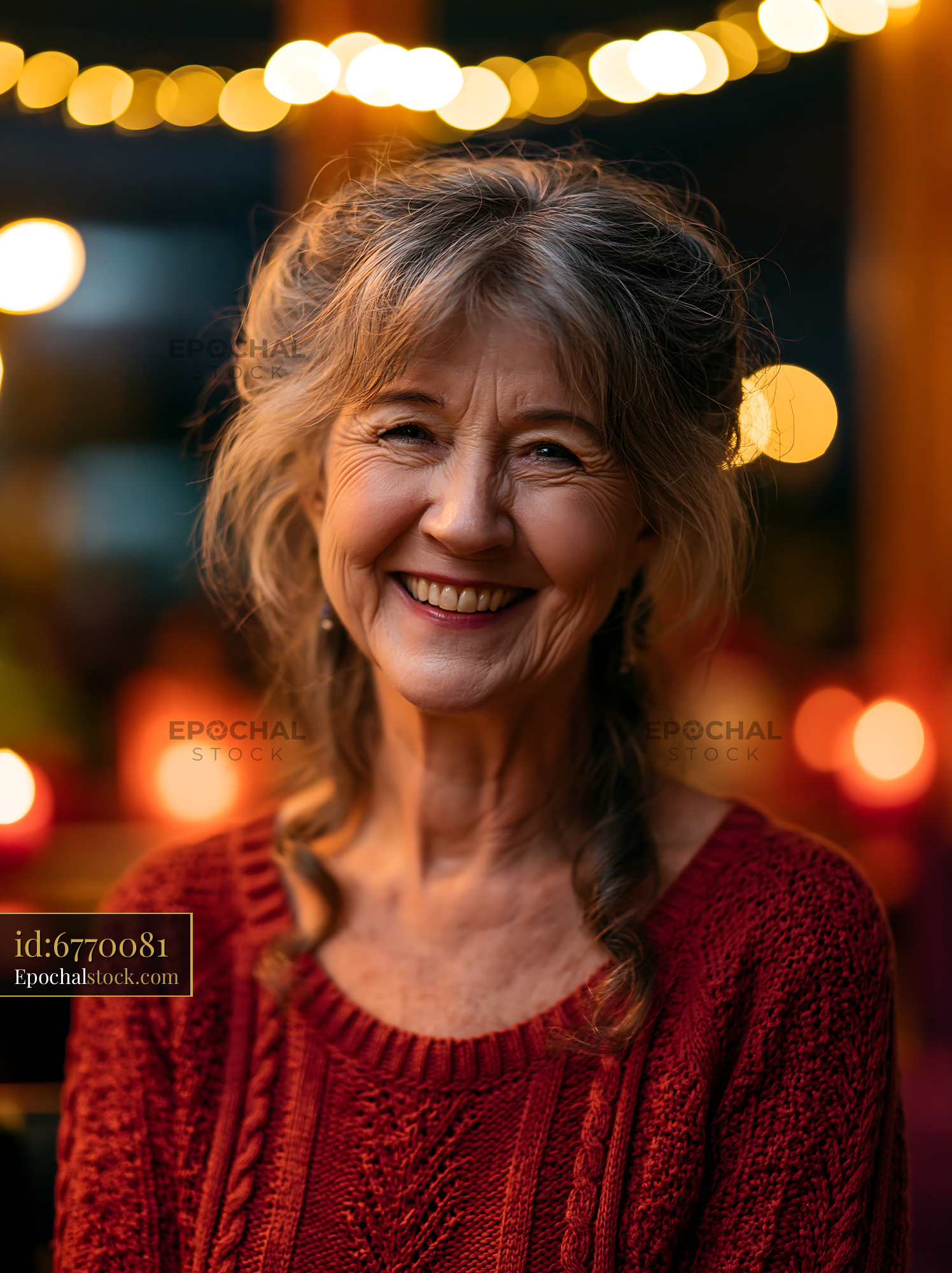 Watermarked full-resolution preview of Smiling woman in a cozy setting with warm lights