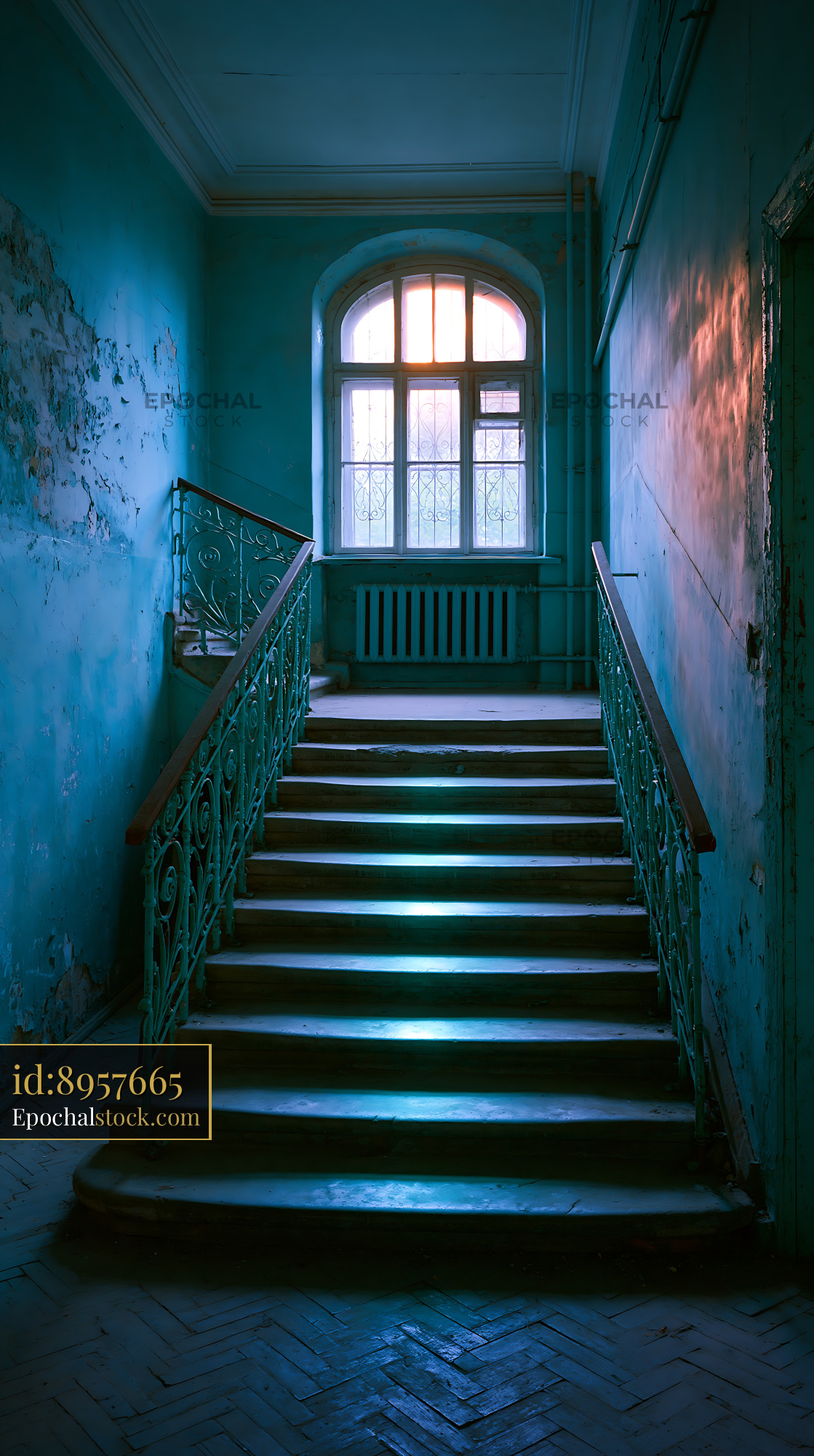 Decaying Stairwell in an Apartment Block With Blue Walls - stock photo