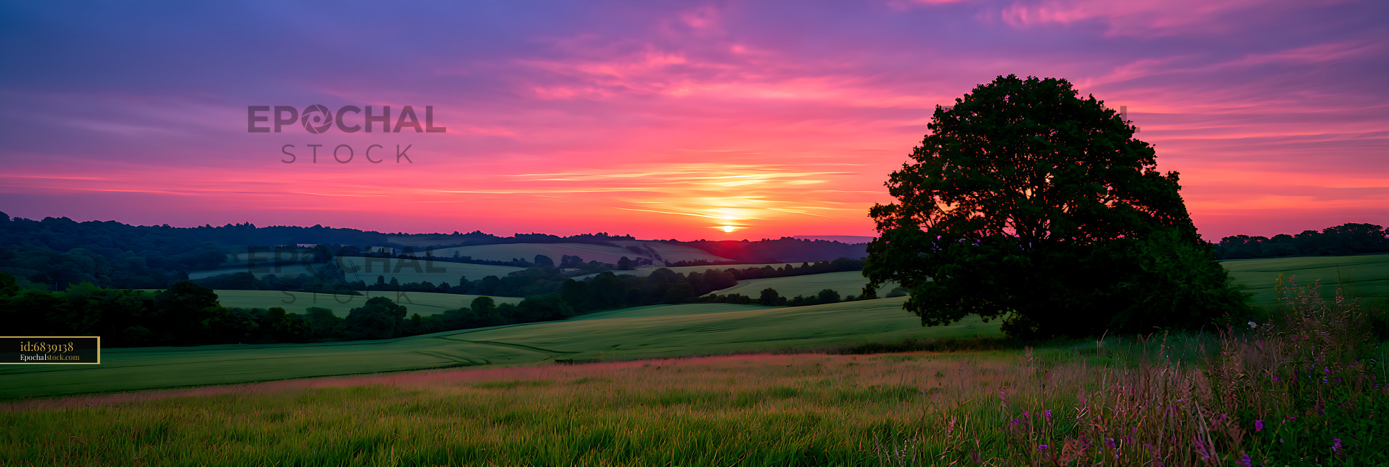 Watermarked full-resolution preview of Colorful evening sunset across peaceful countryside fields