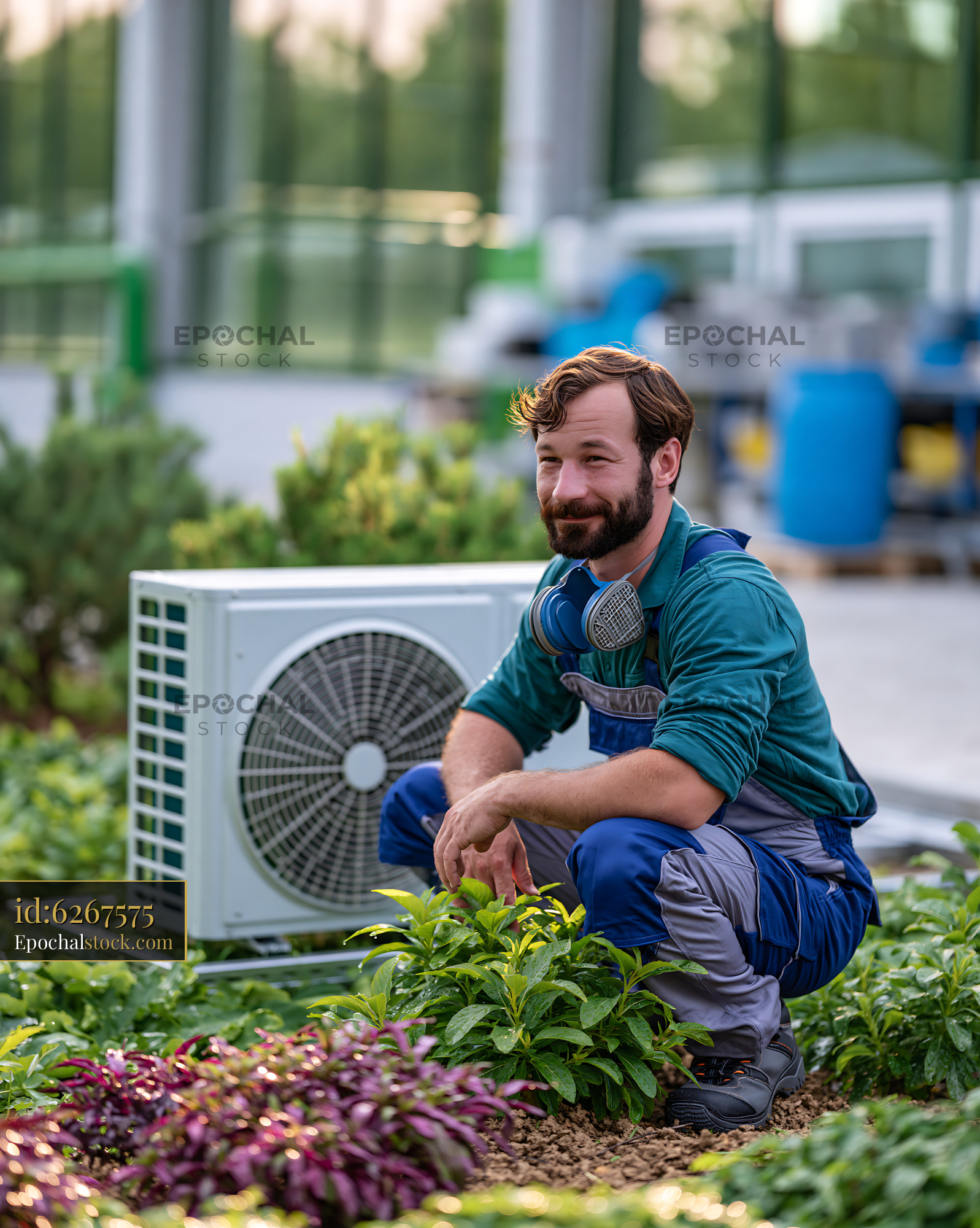 Watermarked full-resolution preview of Man working in a garden with an air conditioning unit nearby