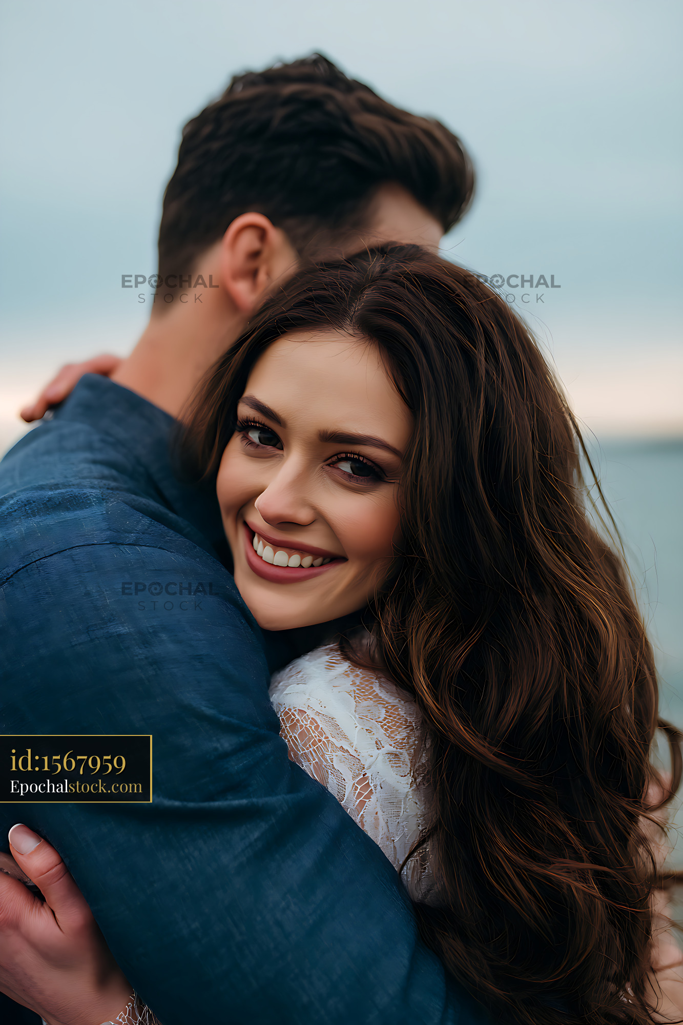 Watermarked full-resolution preview of Happy couple sharing an affectionate outdoor embrace