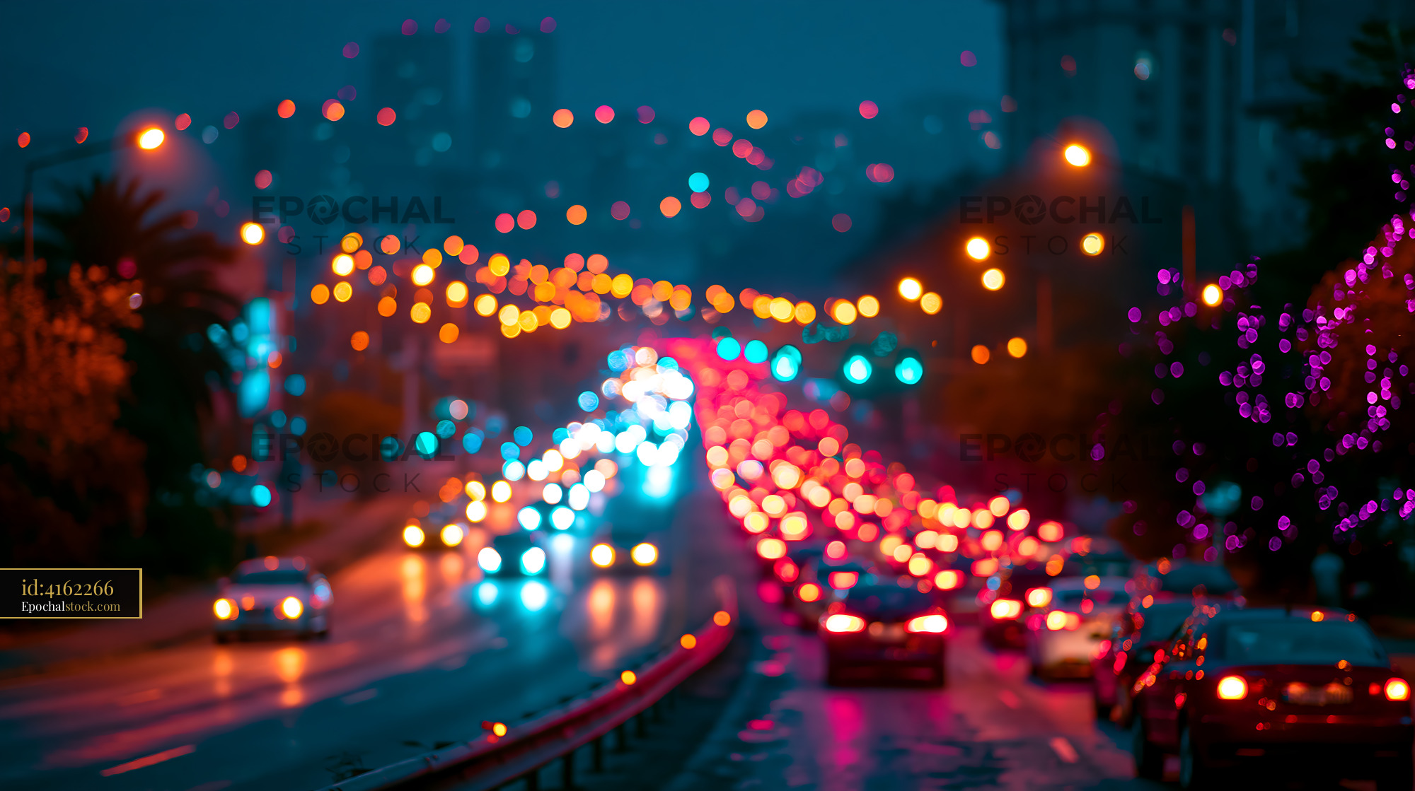 Watermarked full-resolution preview of City street at night with traffic lights and blurred cars
