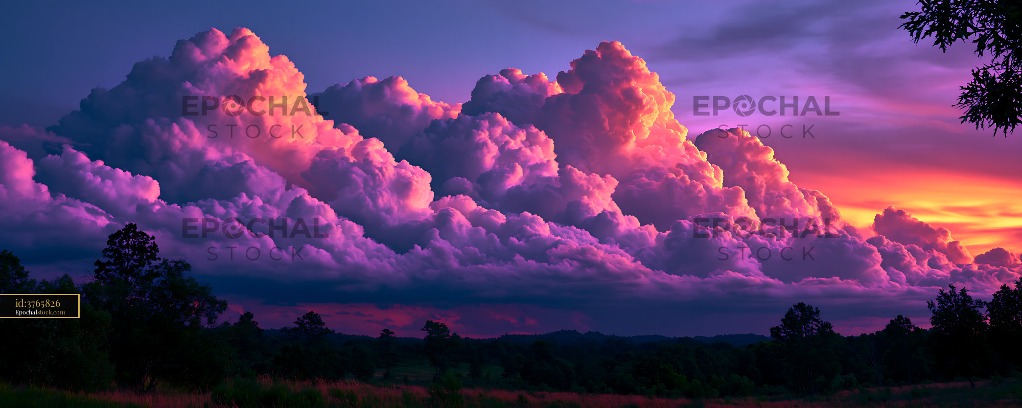 Watermarked full-resolution preview of Colorful clouds at sunset over a rural landscape