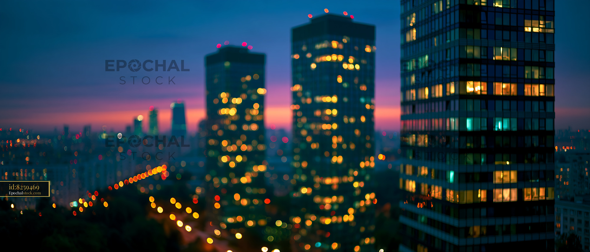 Watermarked full-resolution preview of Night cityscape with illuminated buildings and sunset sky