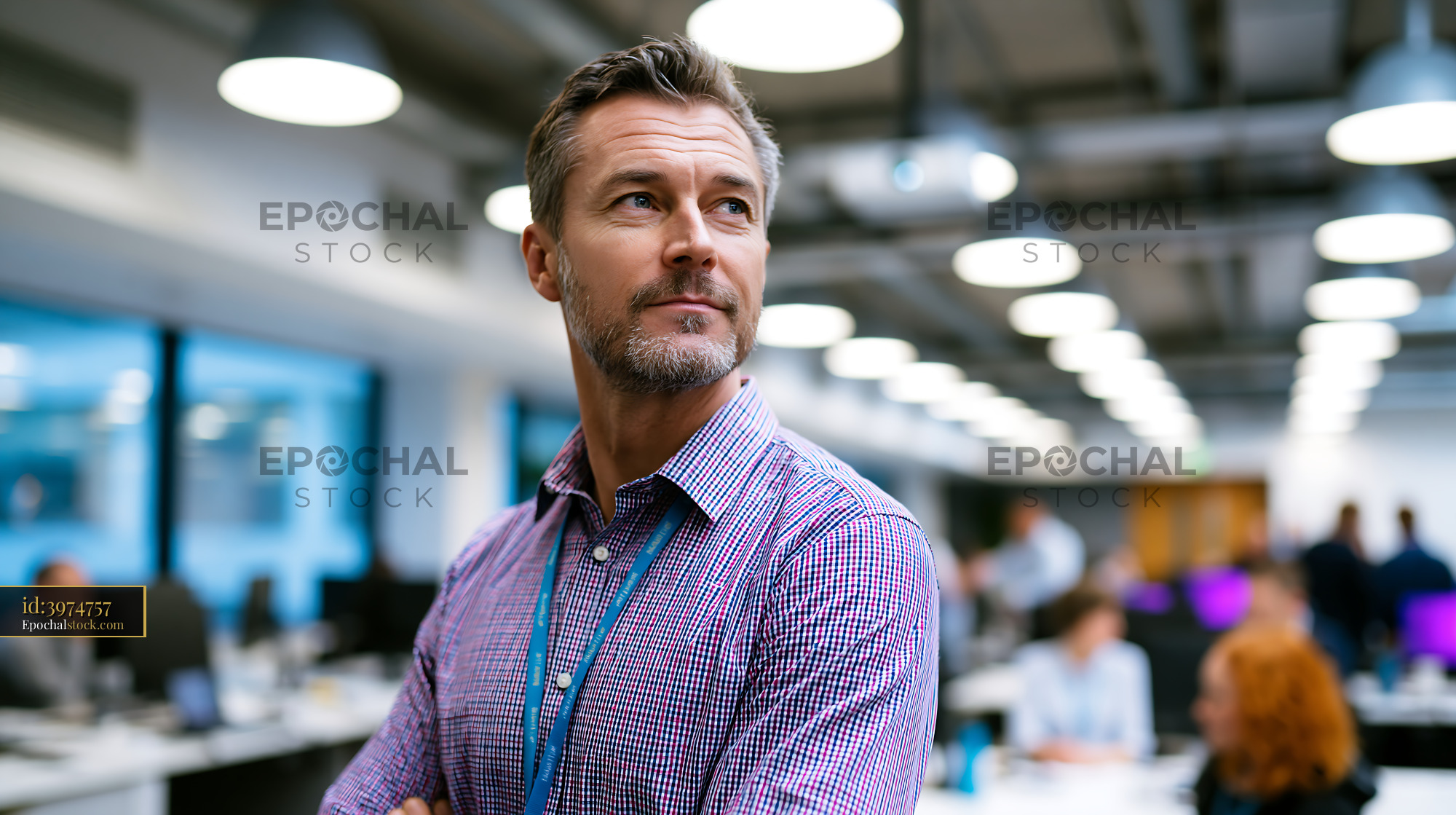 Watermarked full-resolution preview of Business man in office looking thoughtful
