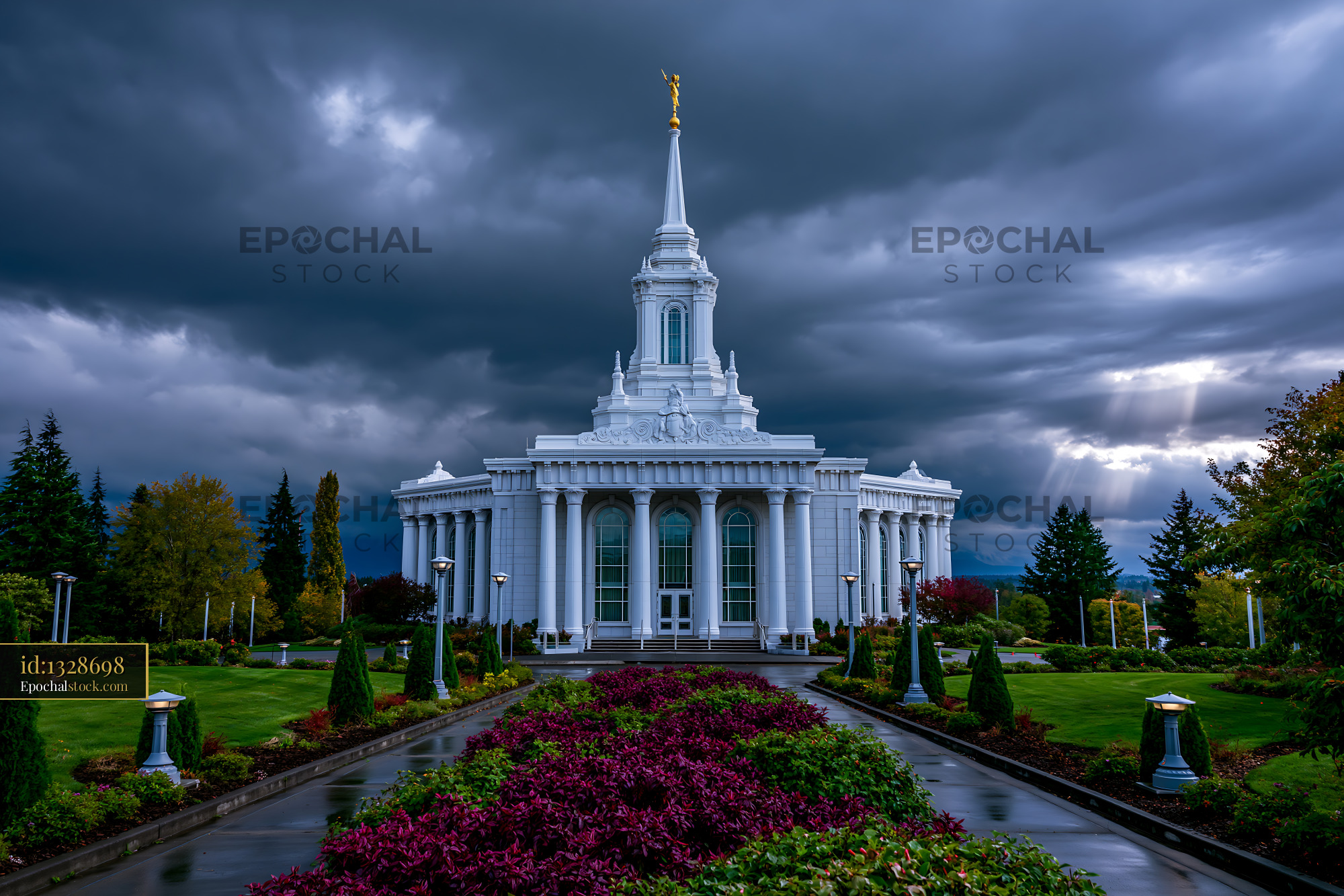 Watermarked full-resolution preview of Building with a tall spire under dark clouds in a garden
