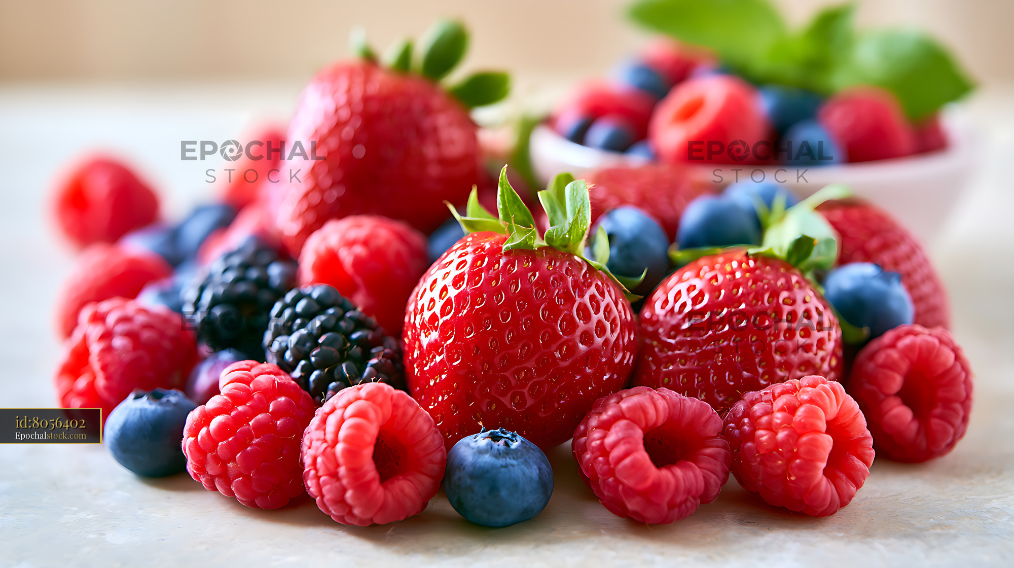Watermarked full-resolution preview of Colorful assortment of fresh berries in close-up