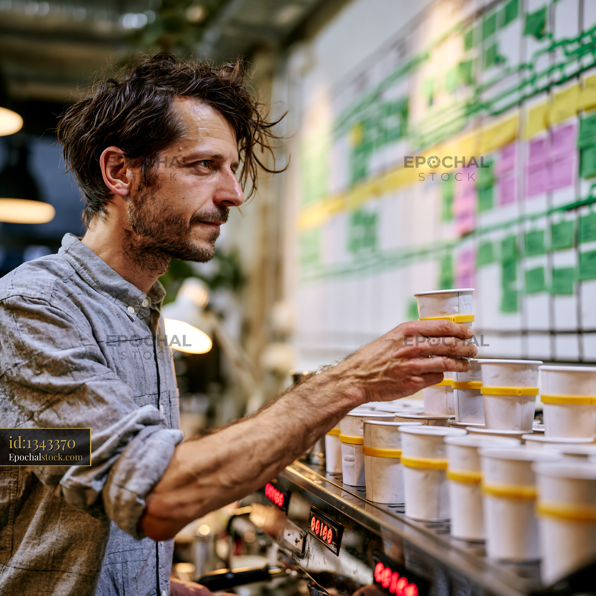 Watermarked full-resolution preview of Barista preparing drinks in coffee shop