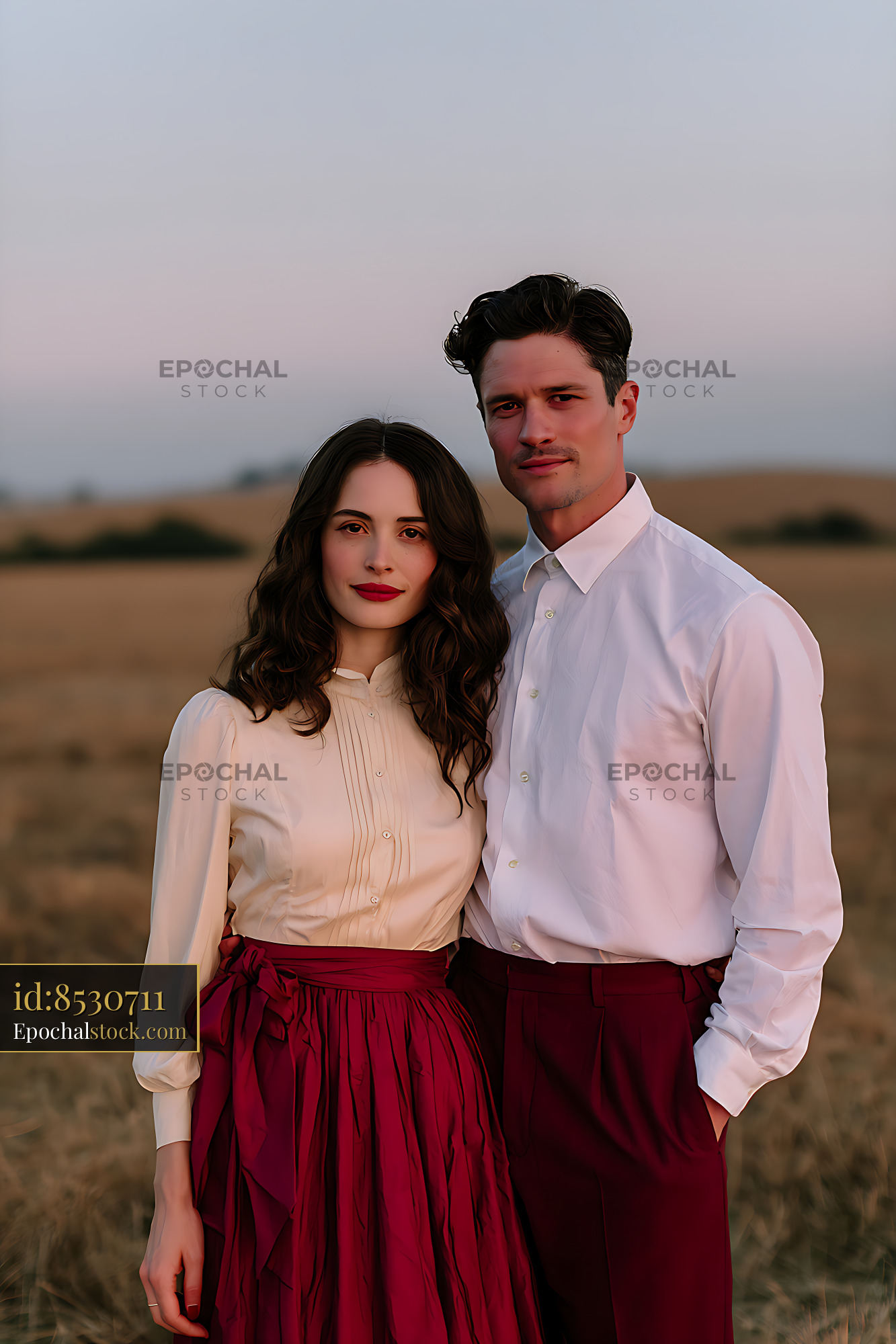 Watermarked full-resolution preview of Two adults in coordinated white and red outfits outdoors