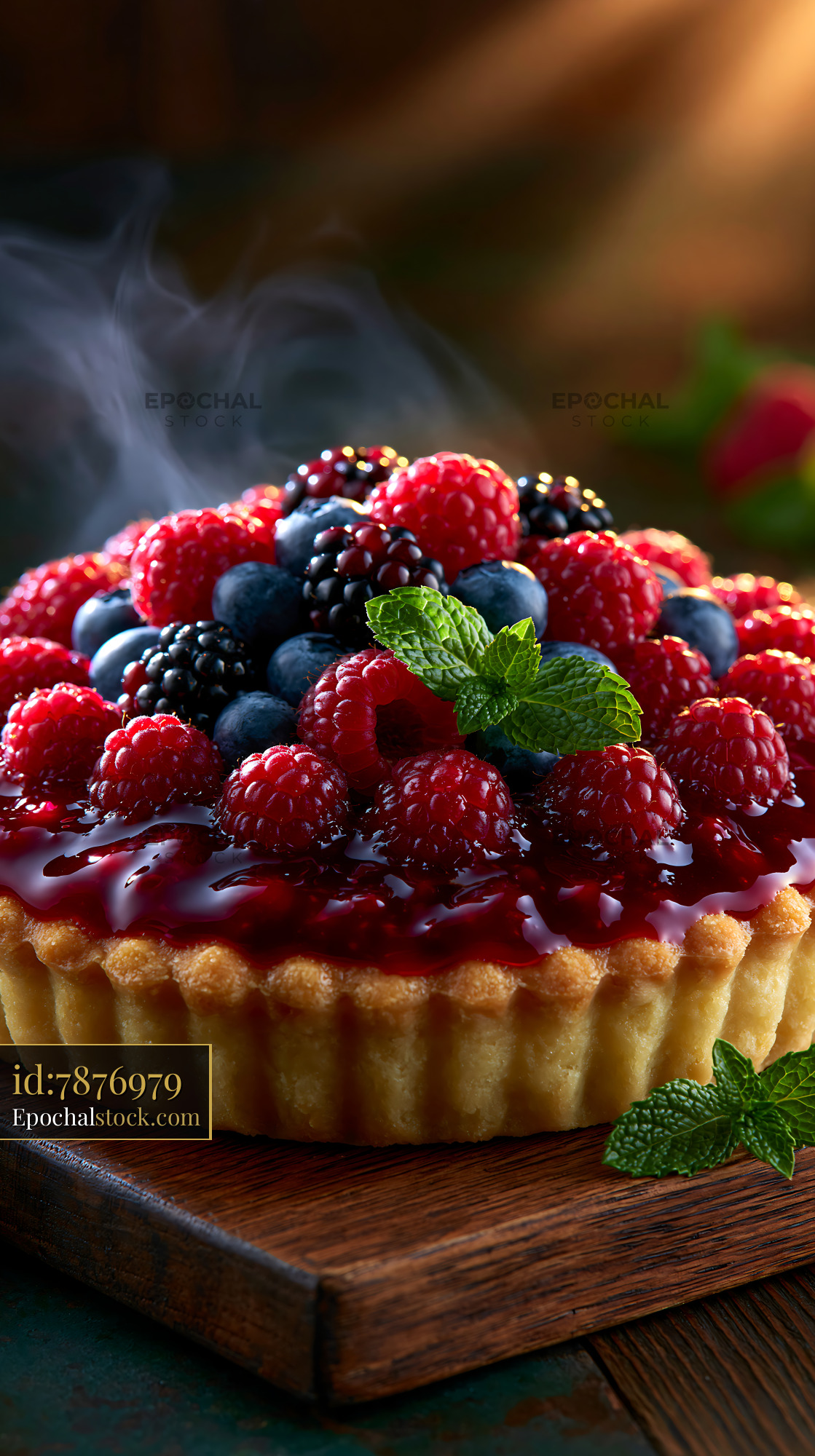 Watermarked full-resolution preview of Mixed berry tart topped with fresh fruit and mint