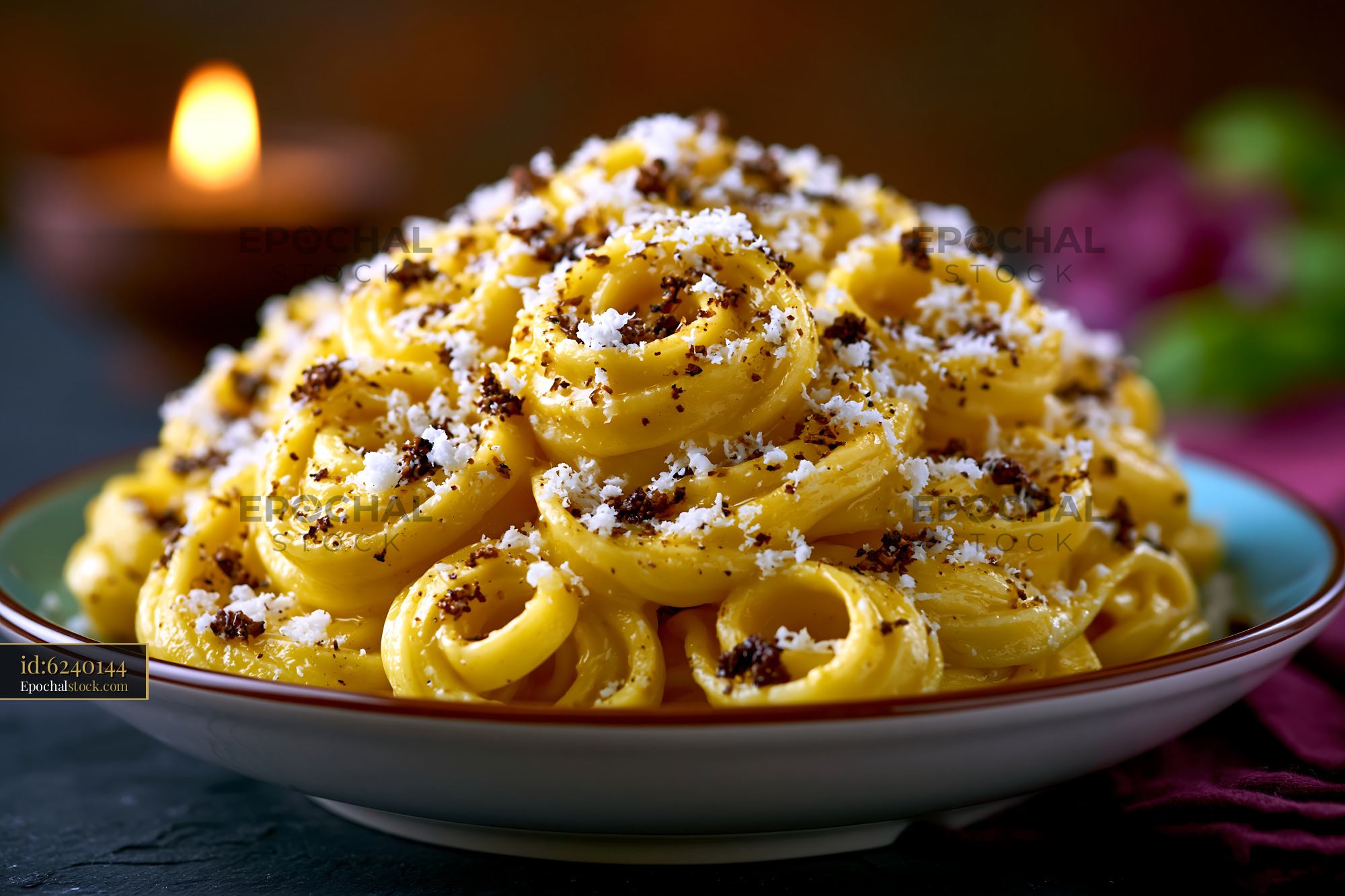 Watermarked full-resolution preview of Creamy pasta dish with cheese and black pepper in a bowl