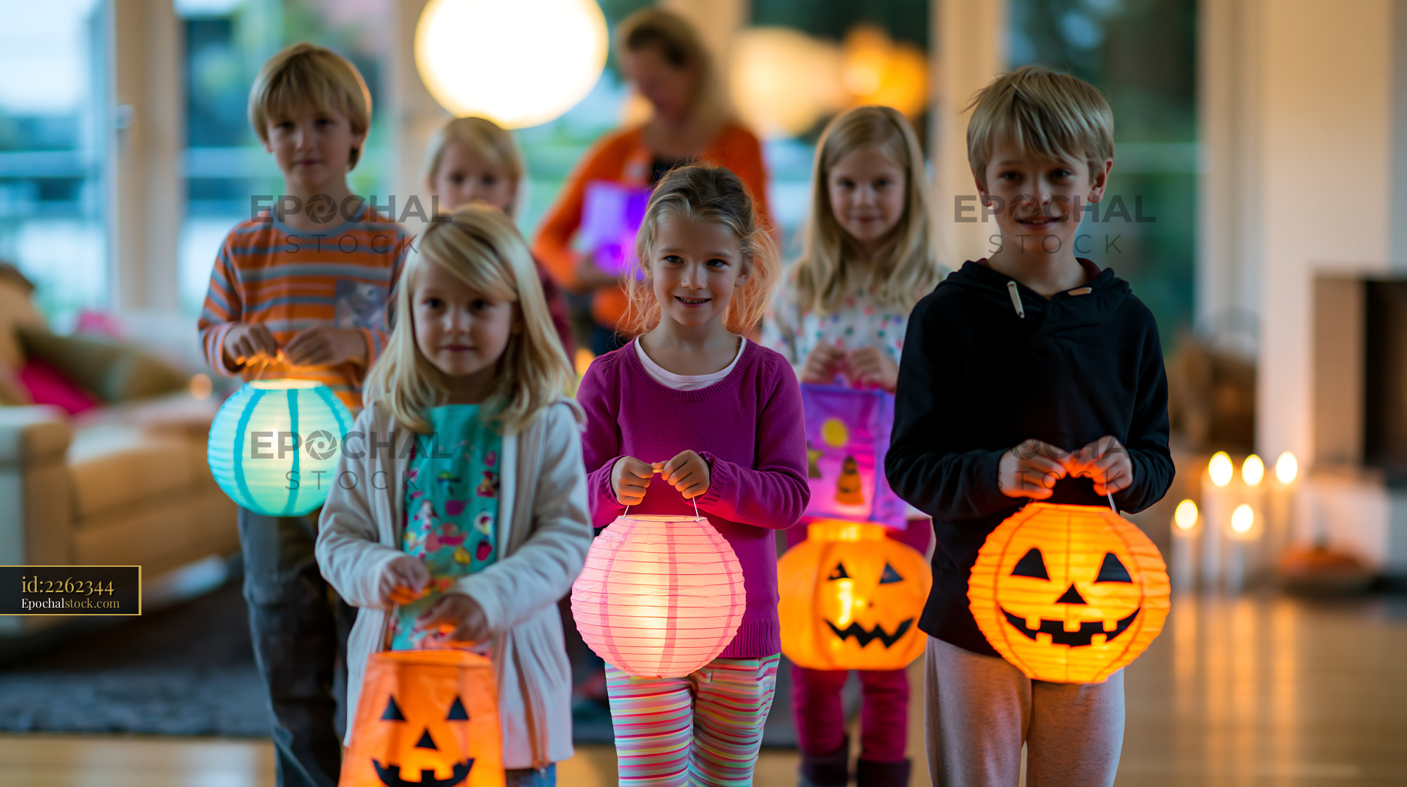 Watermarked full-resolution preview of Children holding colorful lanterns during a festive indoor gathering