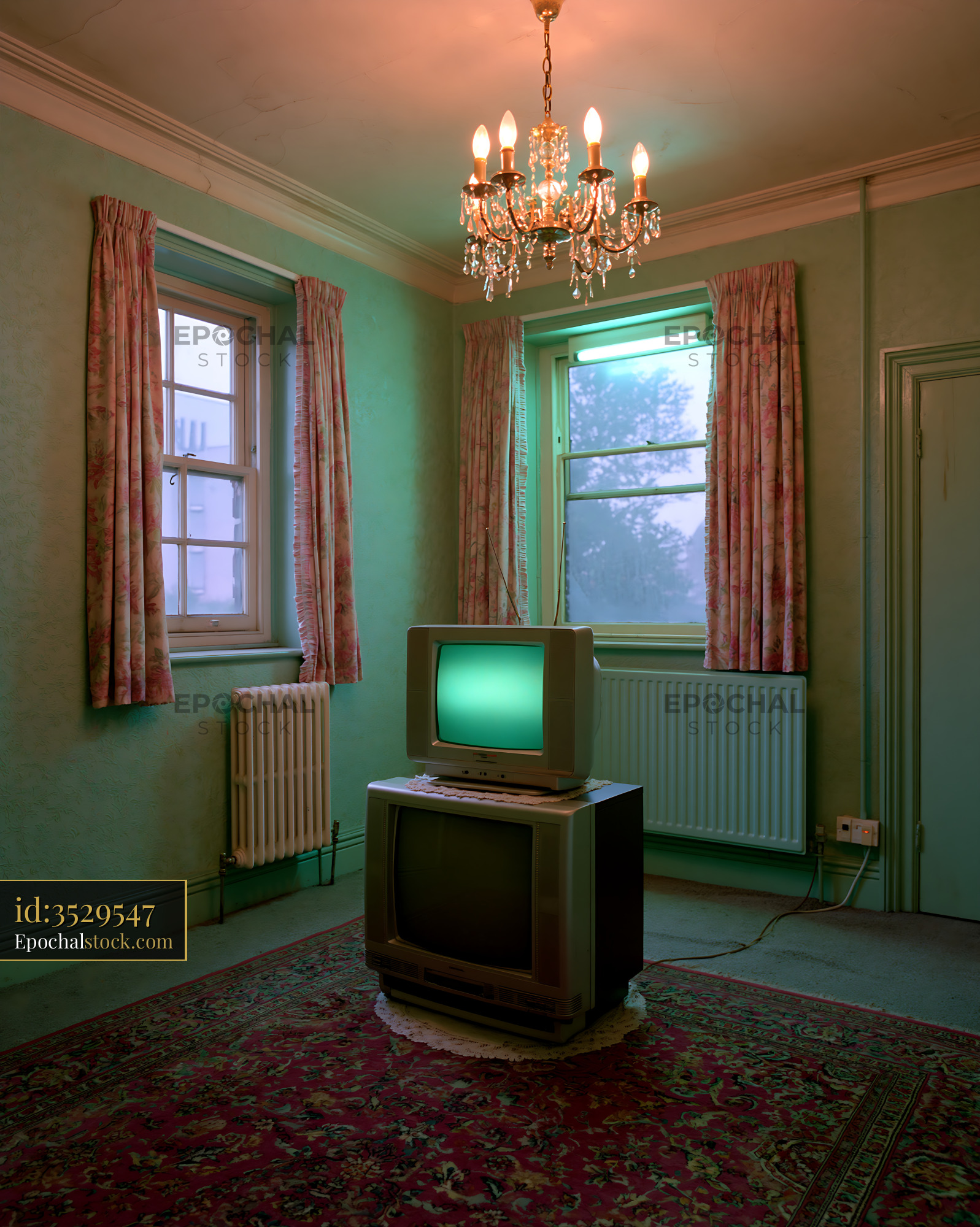 Watermarked full-resolution preview of Old TV set in empty room with green light and chandelier