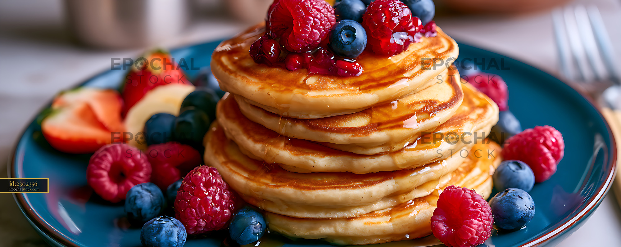 Watermarked full-resolution preview of Golden pancake stack topped with fresh berries