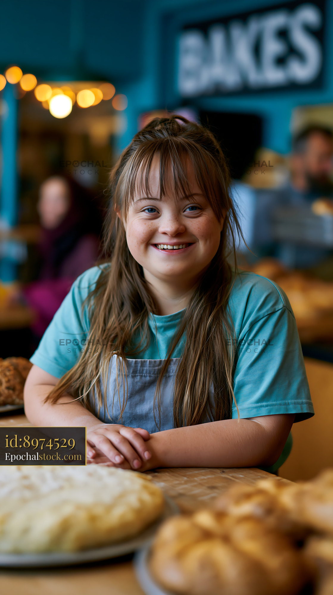 Watermarked full-resolution preview of Smiling girl at a bakery during the day