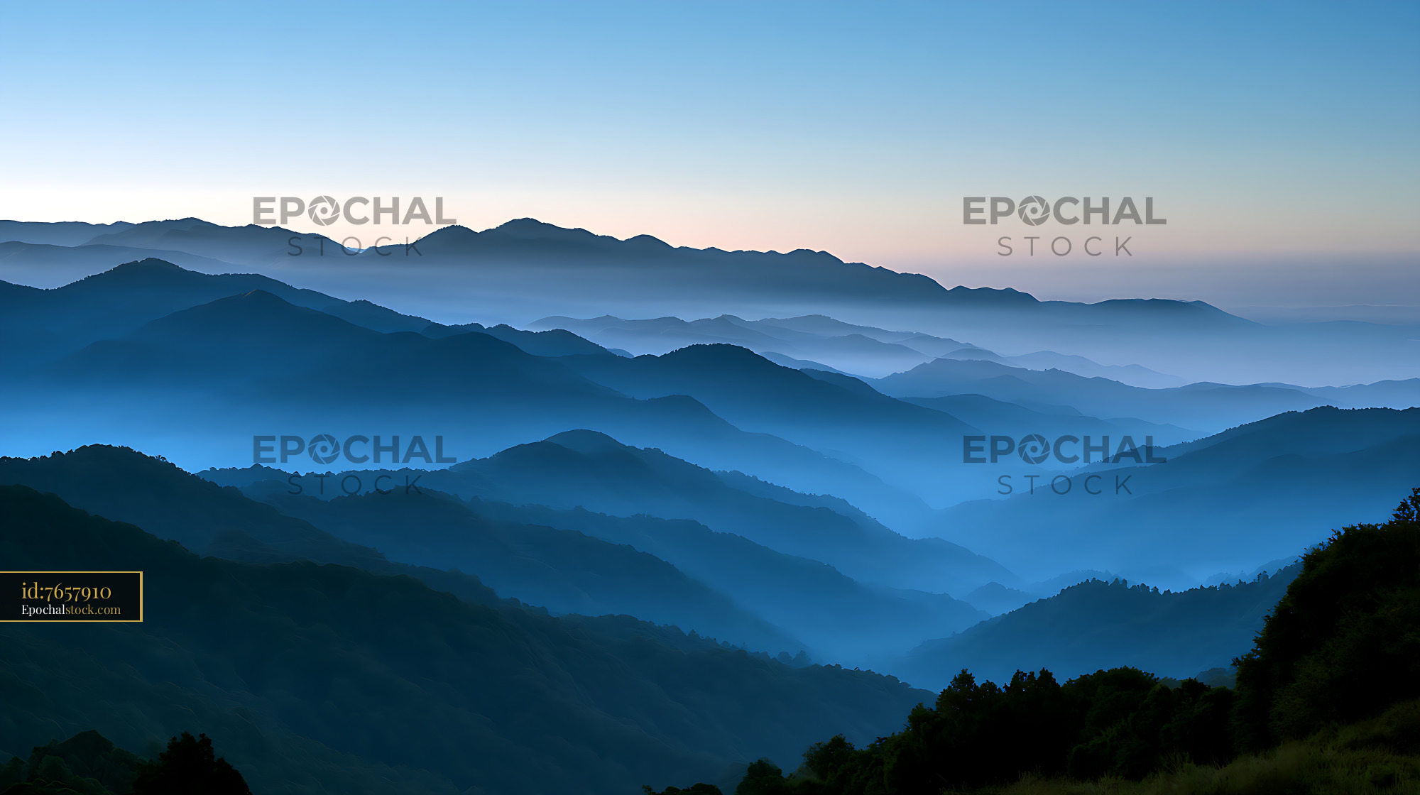 Watermarked full-resolution preview of Layered mountain landscape in blue morning mist